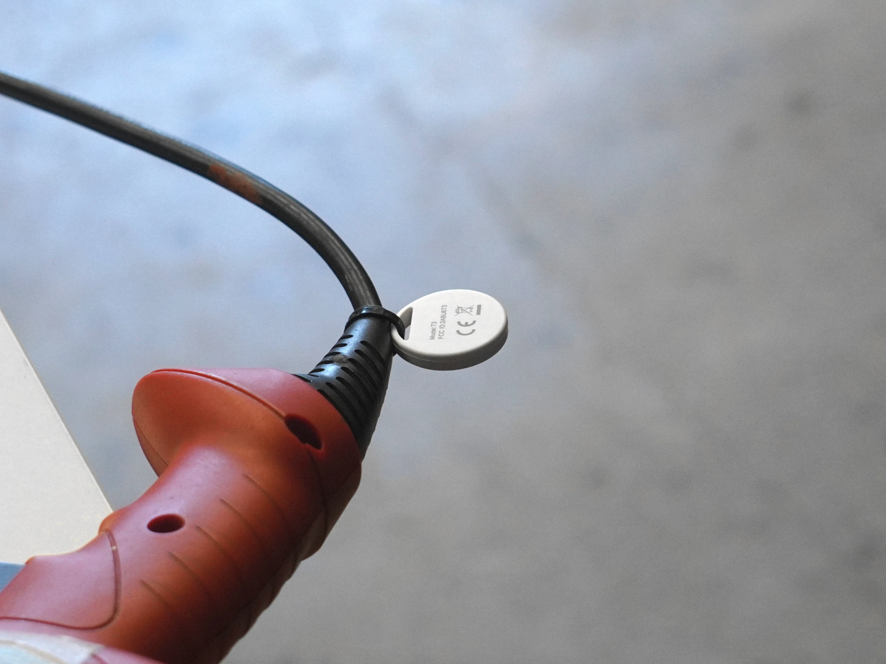 Small low-cost tag attached to a drill via a cable tie