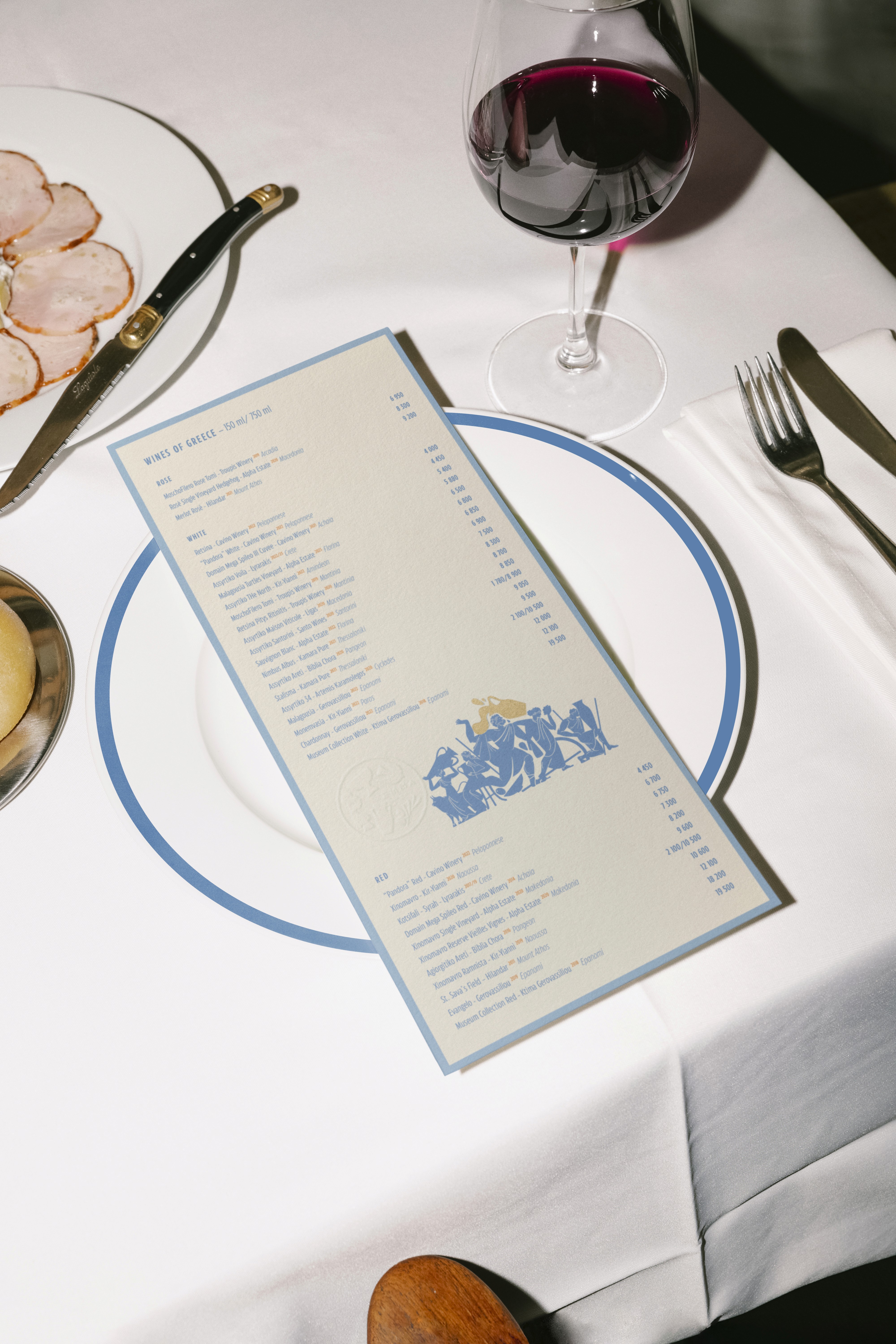 Streetside billboard with flyposters of the Batch.Works brand and illustrations