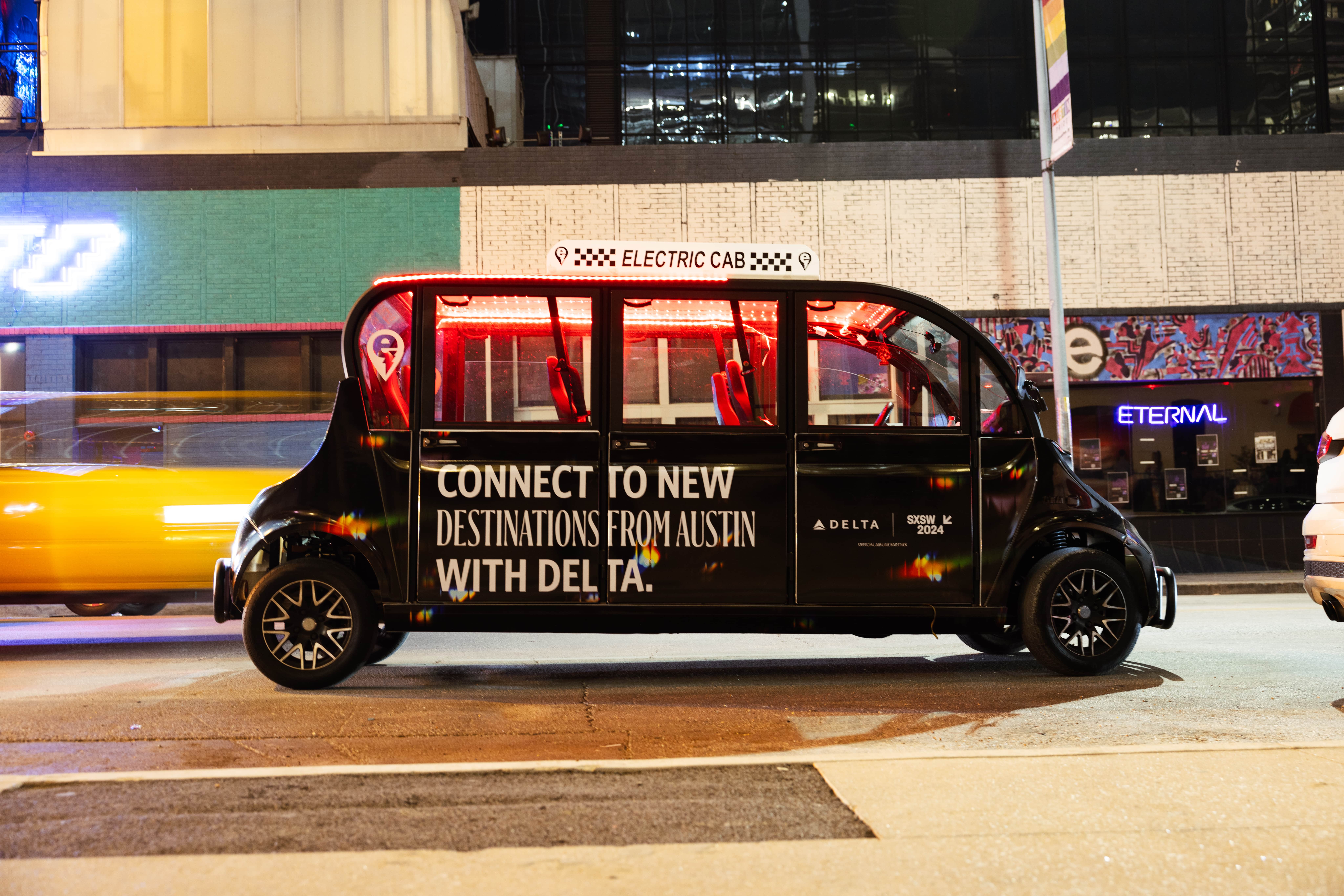 Streetside billboard with flyposters of the Batch.Works brand and illustrations