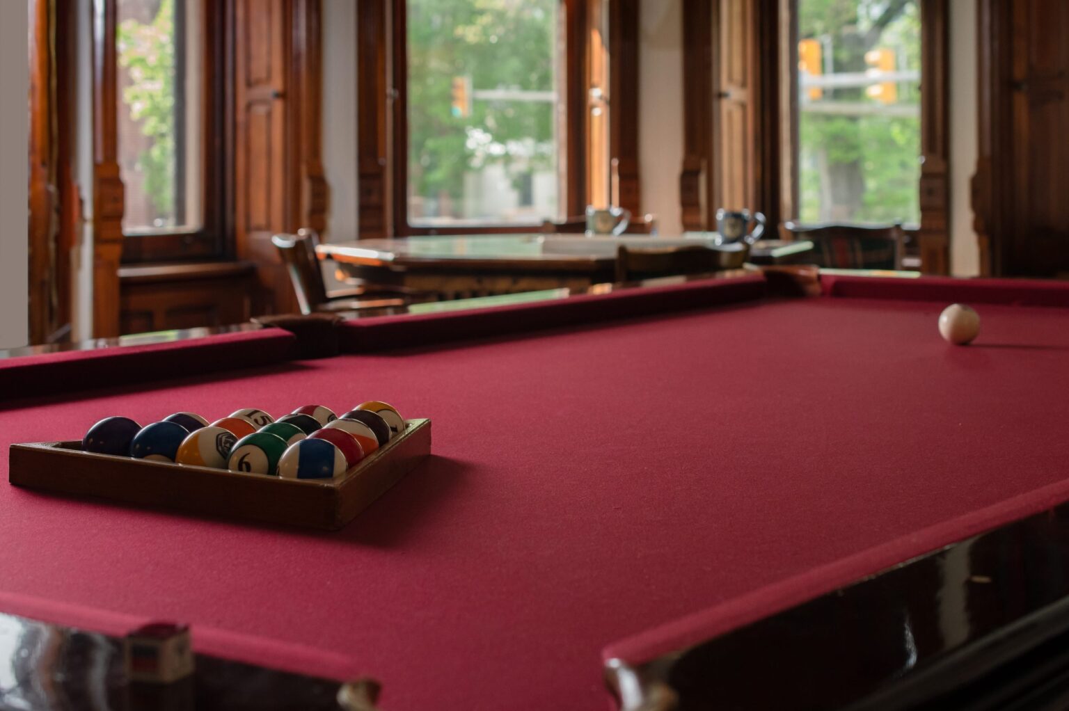 close-up-of-lounge-chair-with-folded-towel-and-book