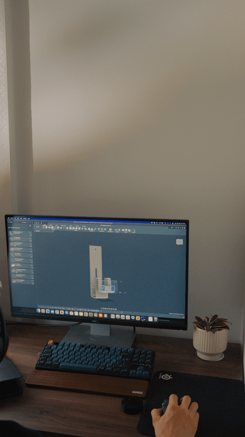 Adrian Falla developing the aluminium lamp holder in CAD at his workstation