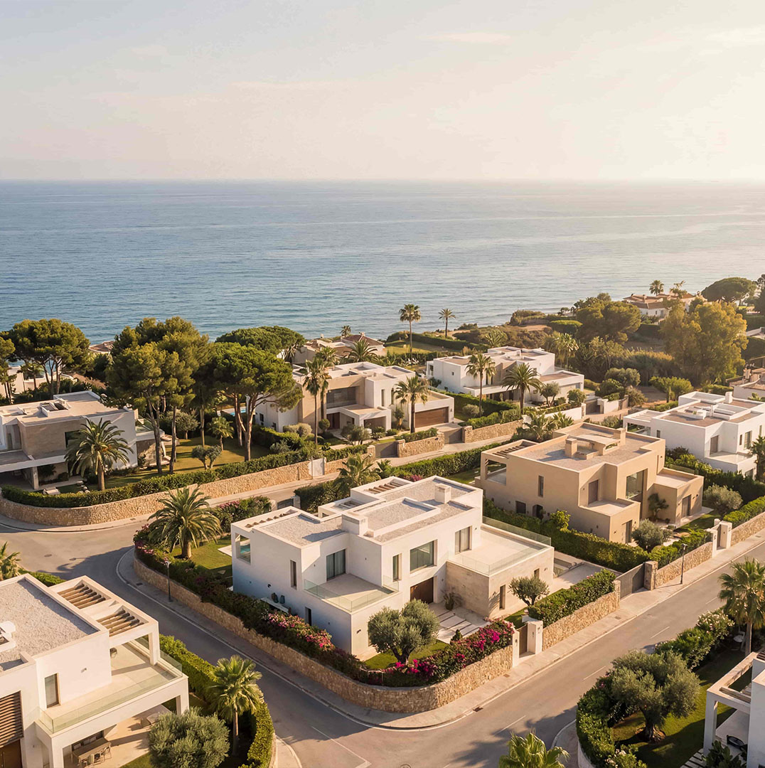 Coastal Marbella neighborhood with modern villas and sea view at sunset