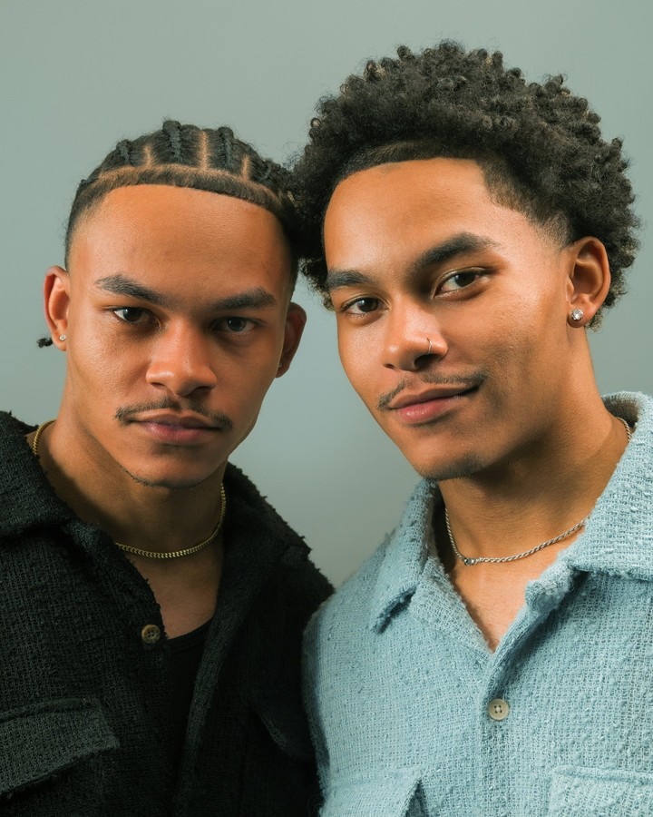 Two subjects photographed together against a blue-grey backdrop