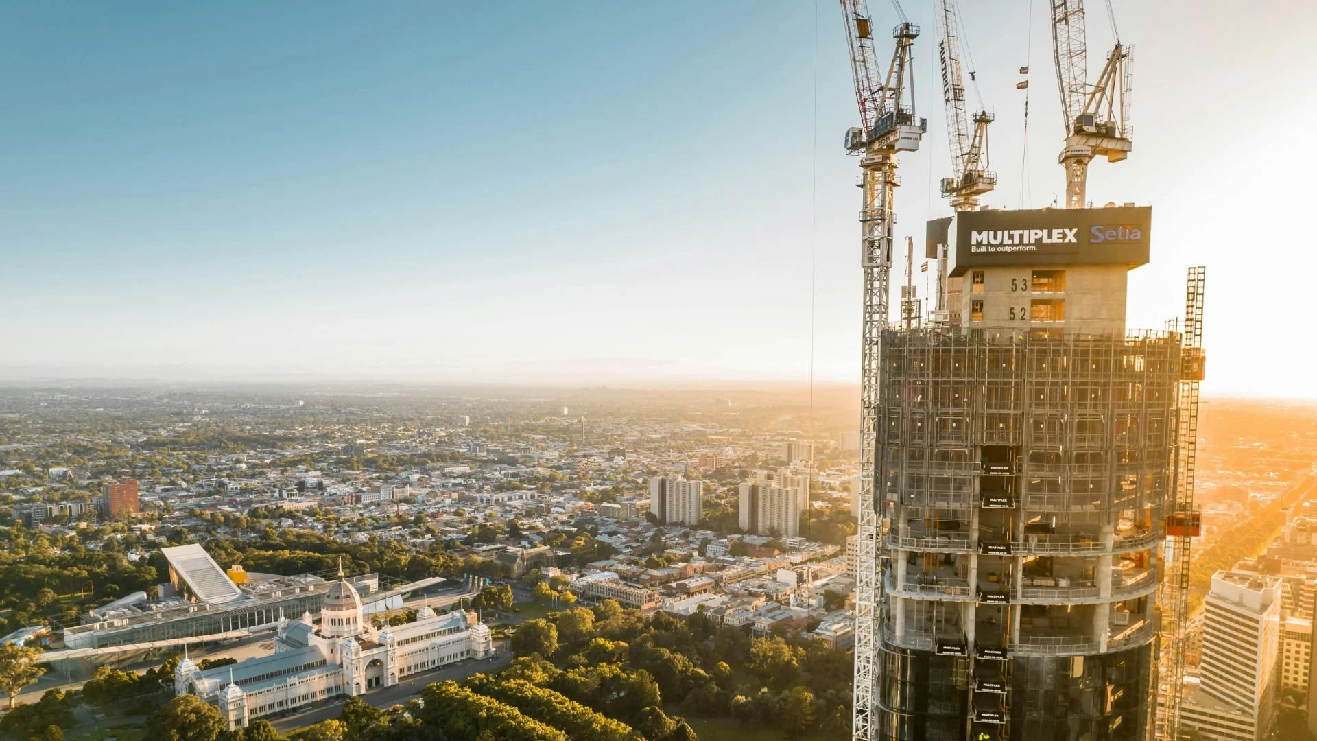 An aerial view of Melbourne City with a tower under construction