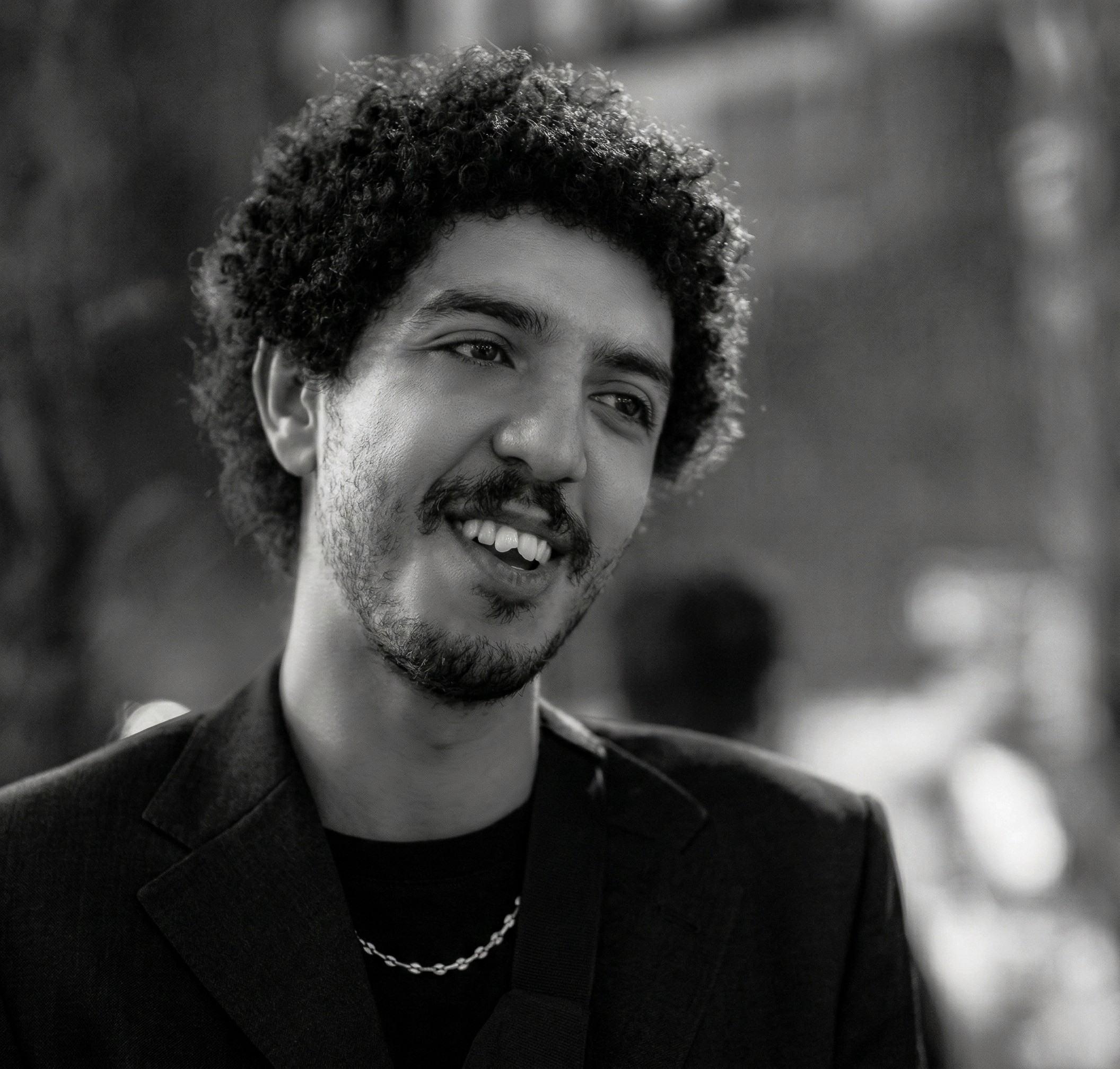 a blurry photo of a person standing in front of a wall