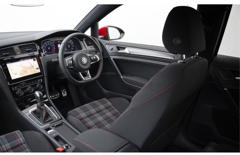 a close up of a steering wheel and dashboard of a car