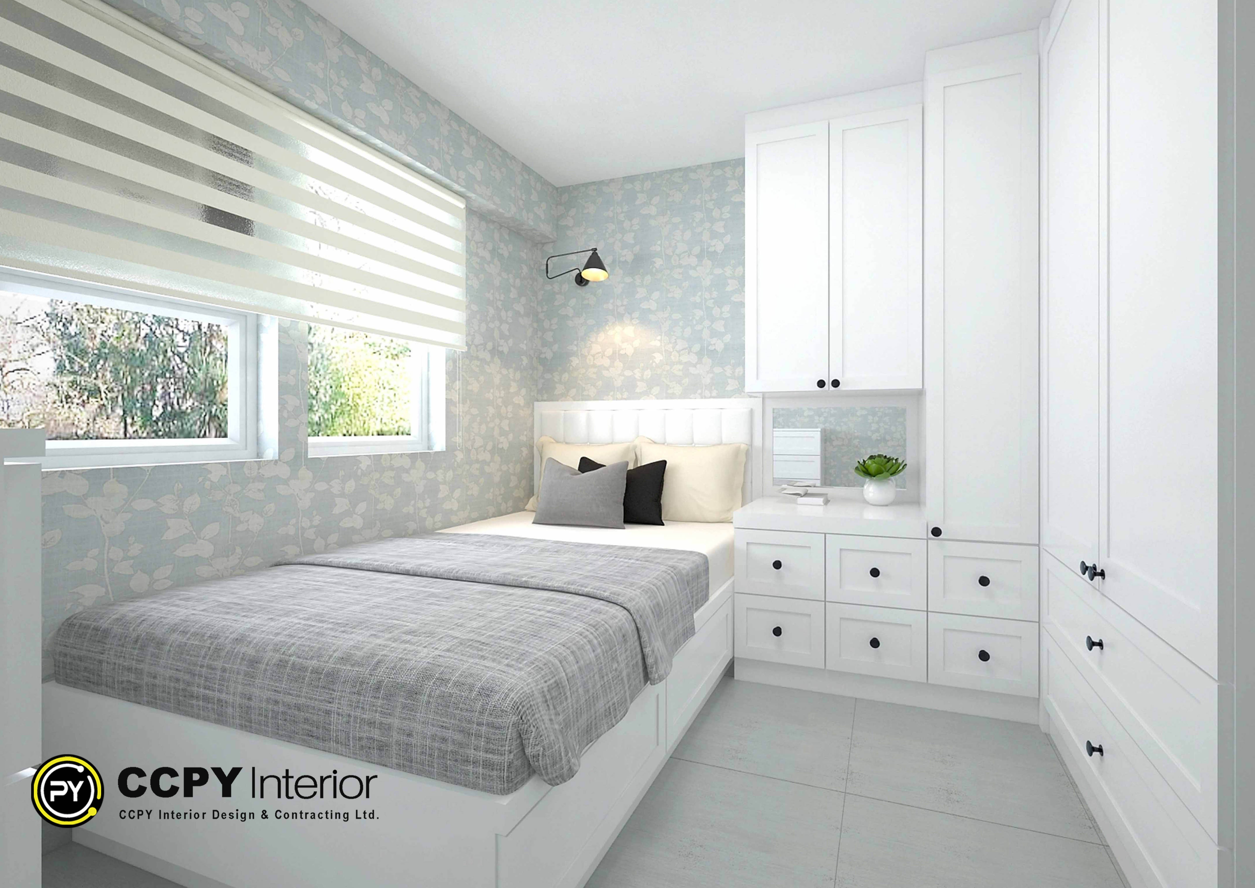 Bedroom corner displaying white custom wardrobes, floral patterned walls, and clean light wood floors at Kwan Lok Sun Chuen.
