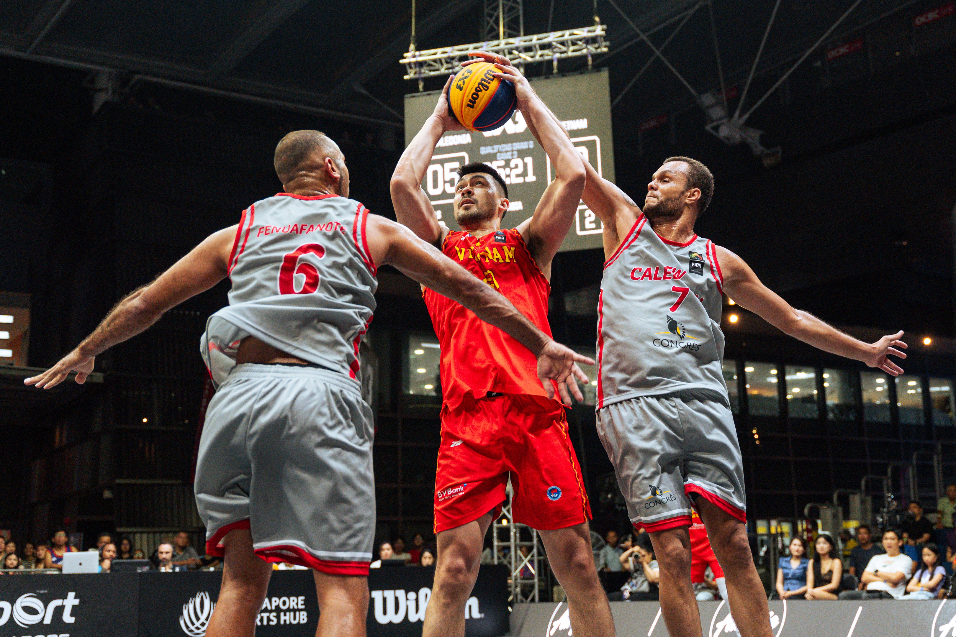 Players challenge for a ball during the FIBA 3x3 tournament in Singapore, 2025