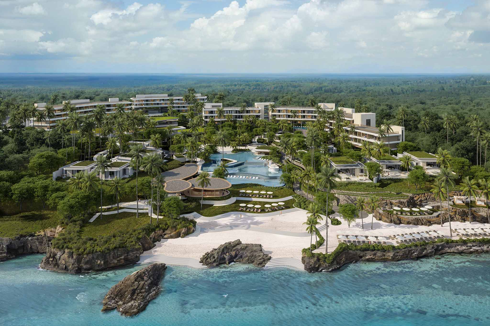 A smiling young man with crossed arms, wearing a plaid shirt and white t-shirt, poses against a dark background.
