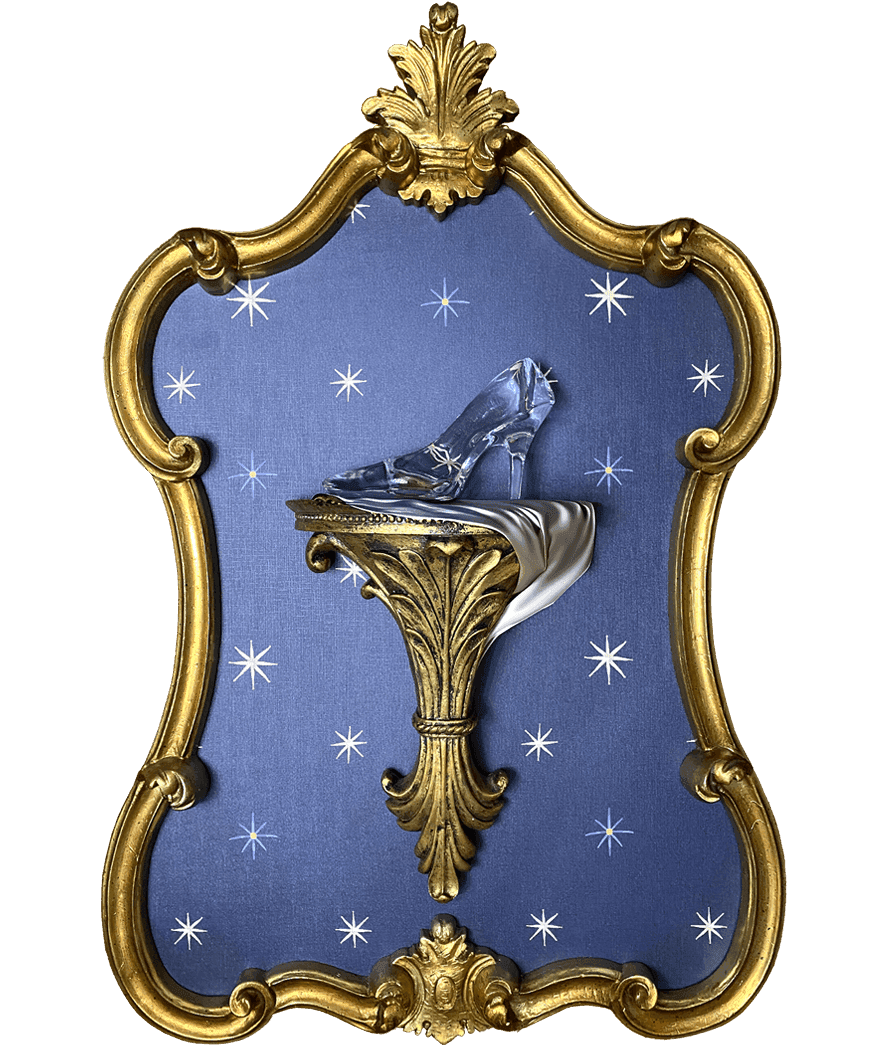 cinderella slipper resting on top of a gilded wall sconce over a star patterned backdrop in a gillded ornate frame