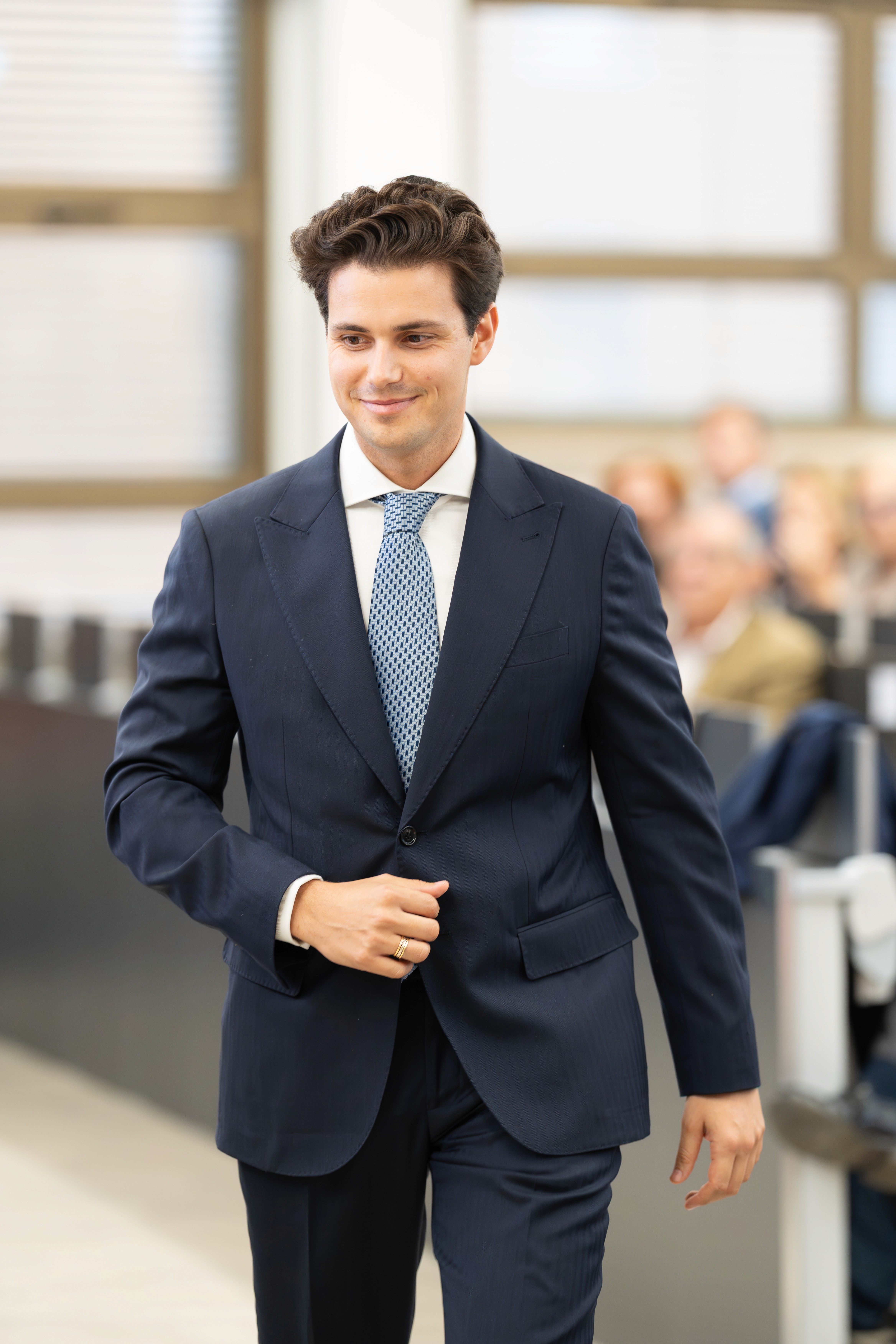 a blurry photo of a person standing in front of a wall