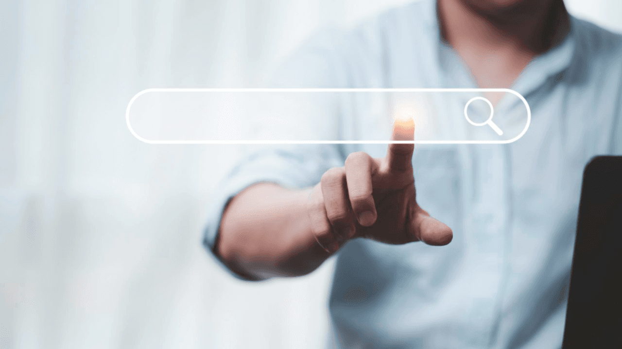 Hand touching with search icon for search engine optimisation or seo concept to find information by internet connection