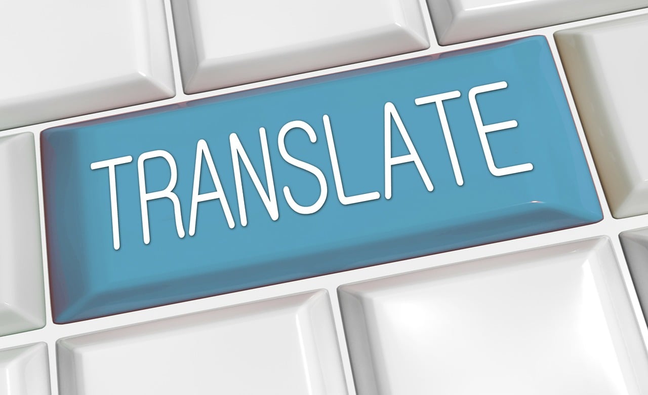 Stock photo with a button that says translate in white text on a light blue background.