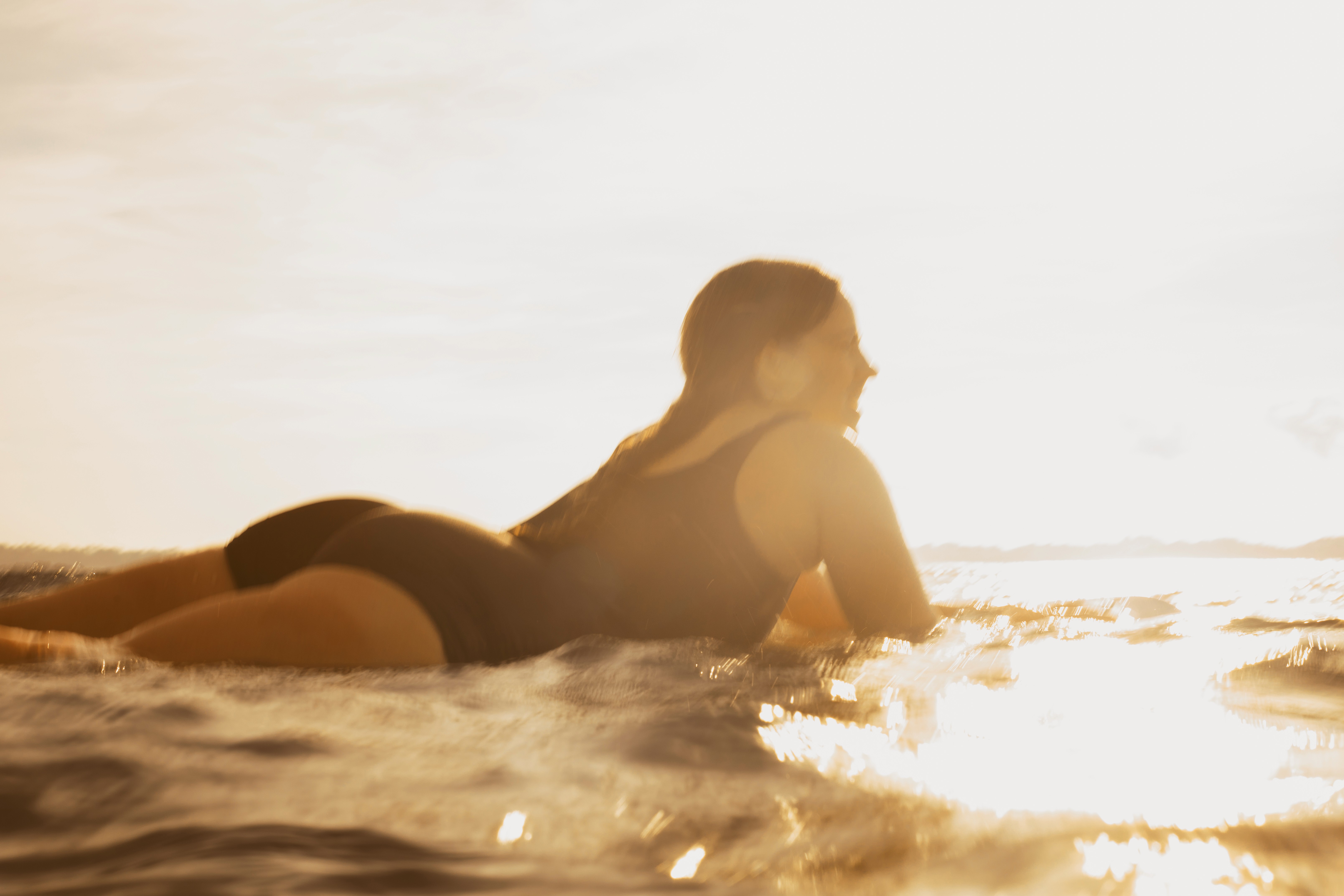Group of men standing with Sufboard
