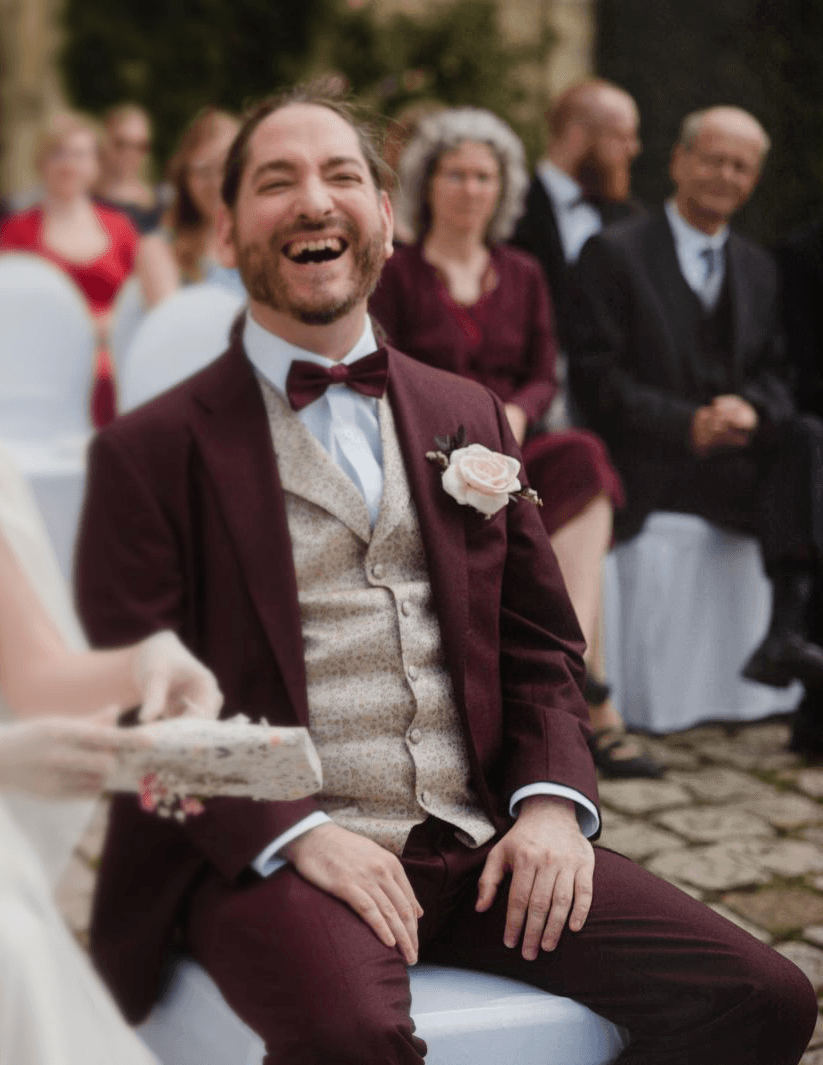 A fast black sports car races down the highway.