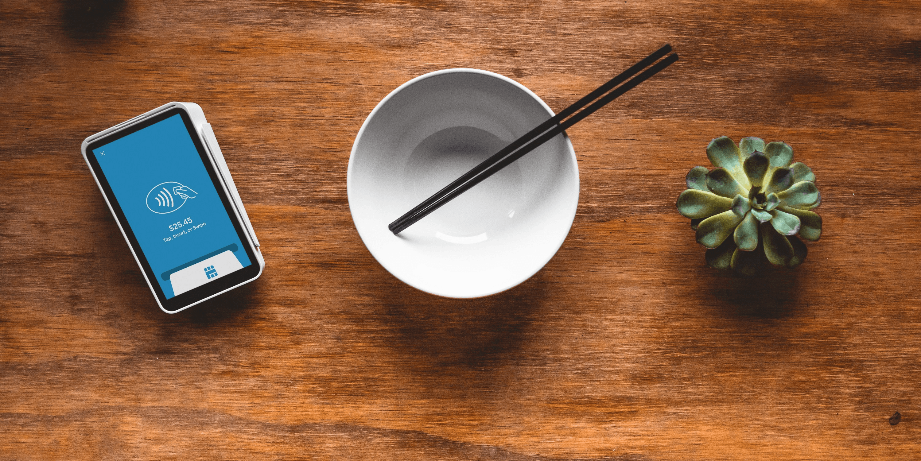 black chopsticks in white ceramic bowl on table