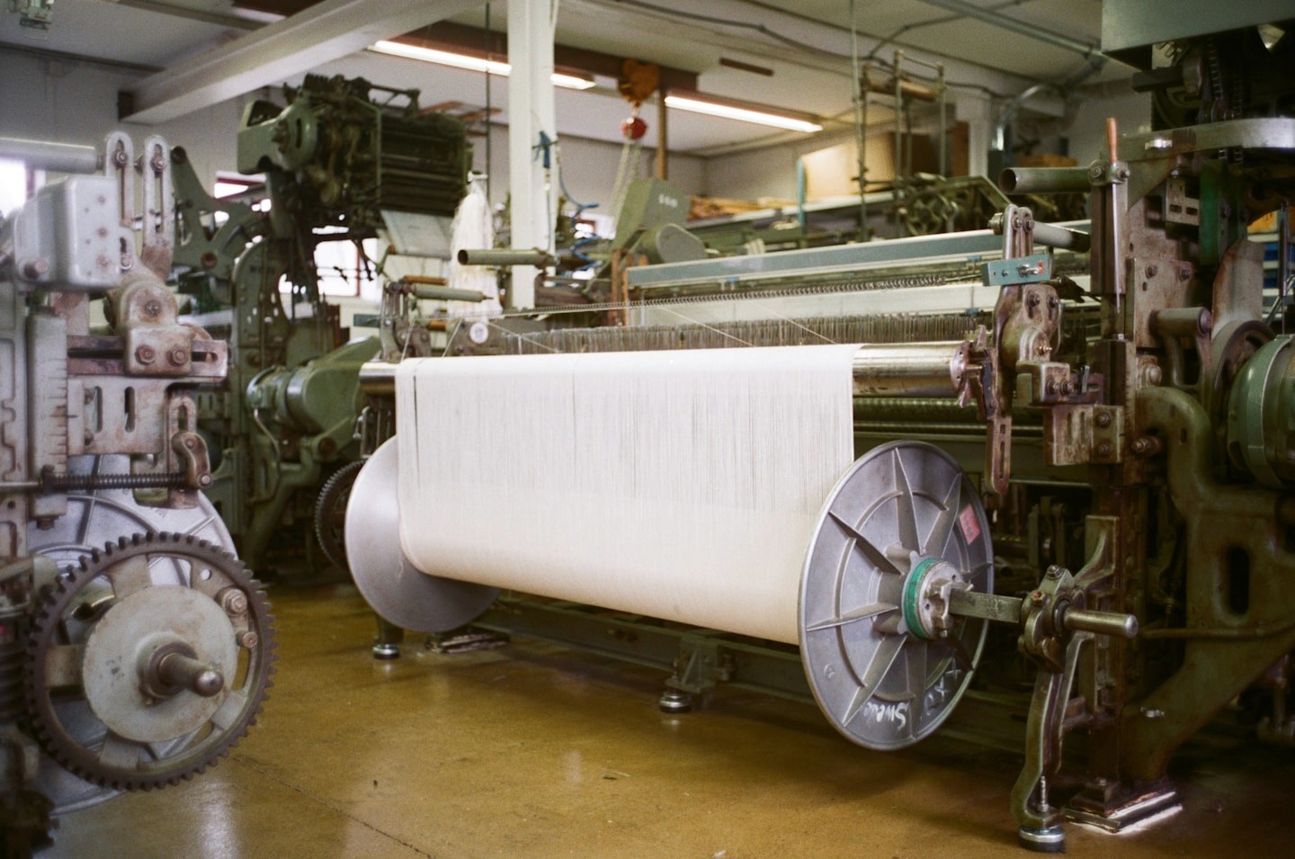 A bolt of linen running on the machine at the mill