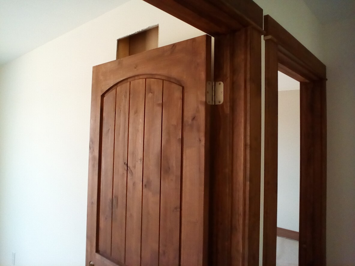 silver door lever on gray door