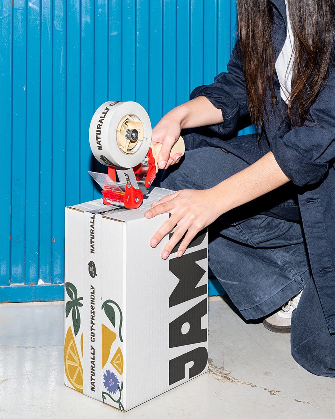 Streetside billboard with flyposters of the Batch.Works brand and illustrations