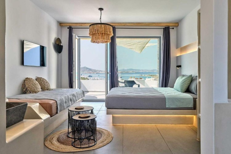 sunloungers fronting buildings near mountain