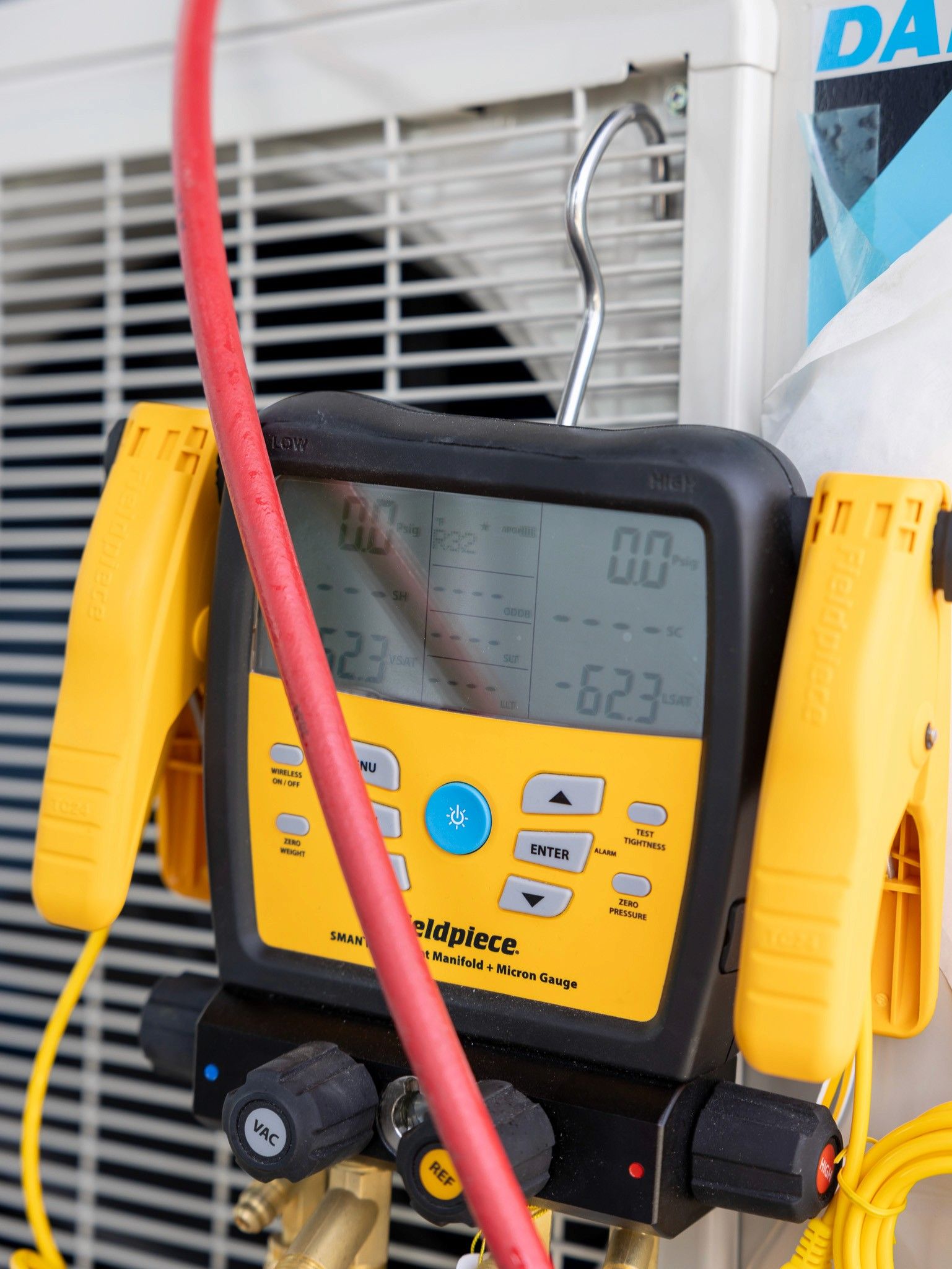 HVAC manifold gauge with digital display for plumbing and pipefitting services in Kelowna, British Columbia.