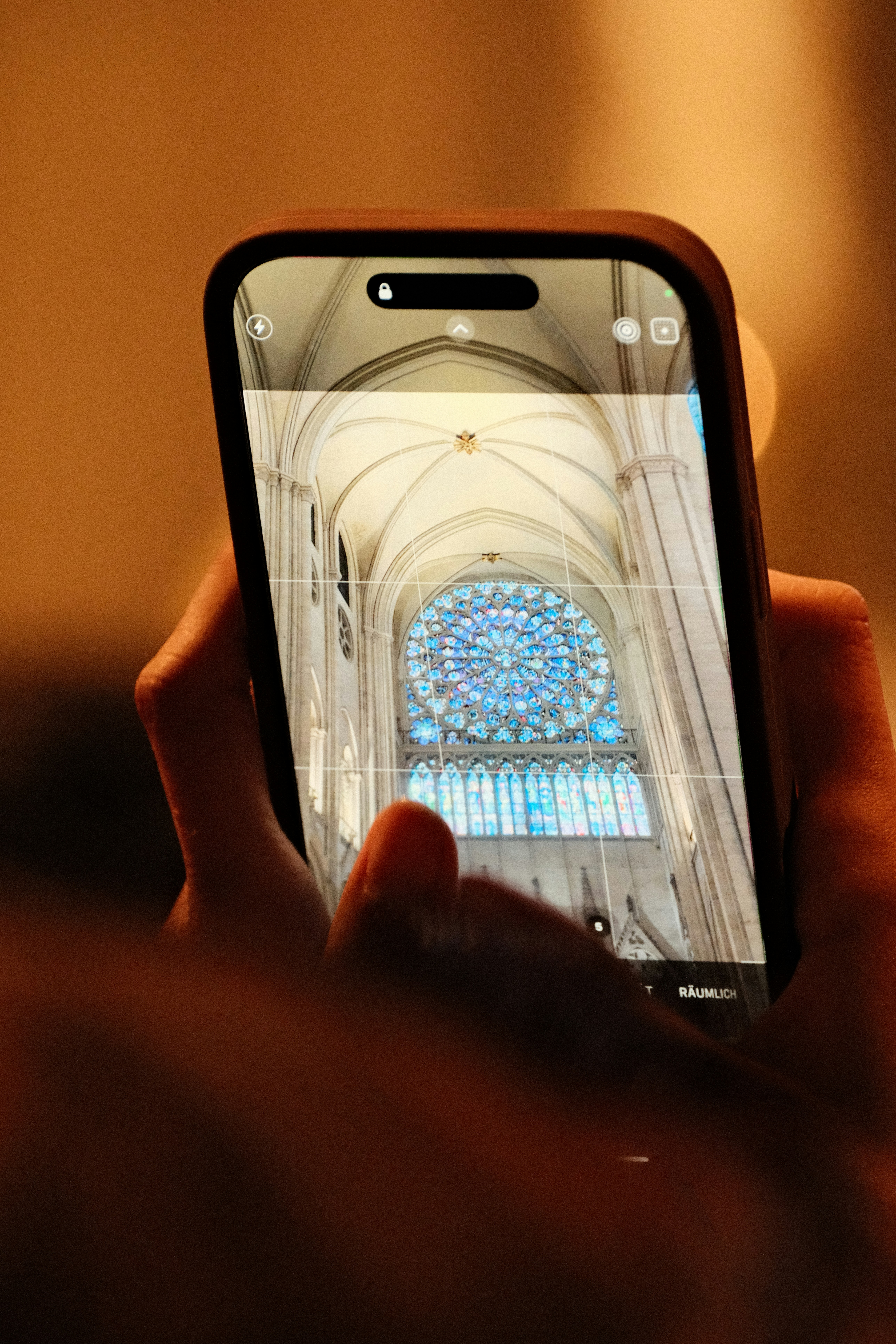 Taking a picture of a stained glass window.