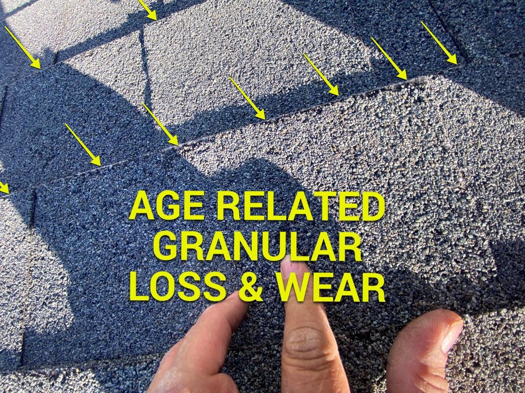 Roof Age related deterioration in Commercial Roof. Granular loss and wear of asphalt shingles. 