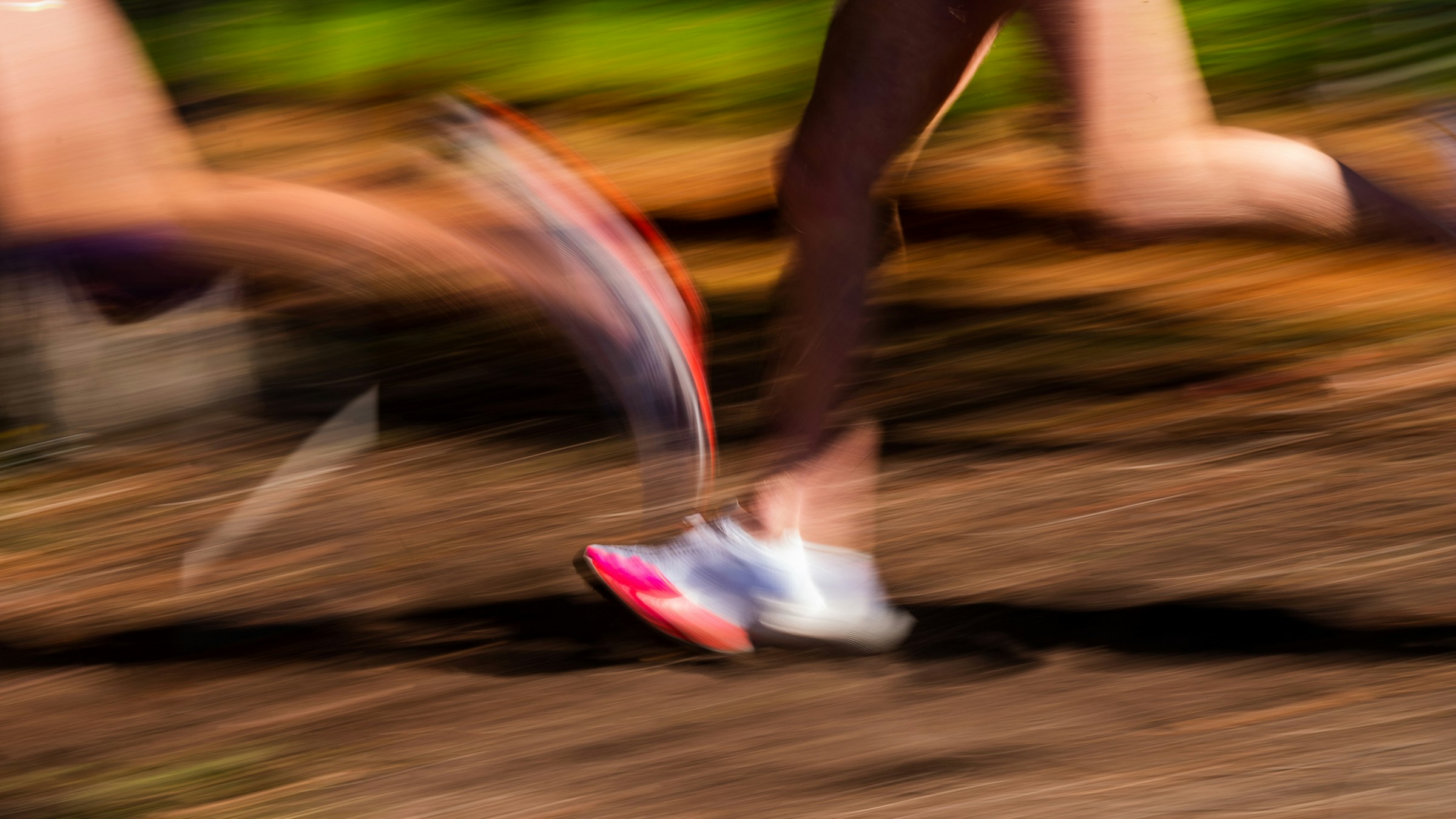 Blurred feet of runners on a track