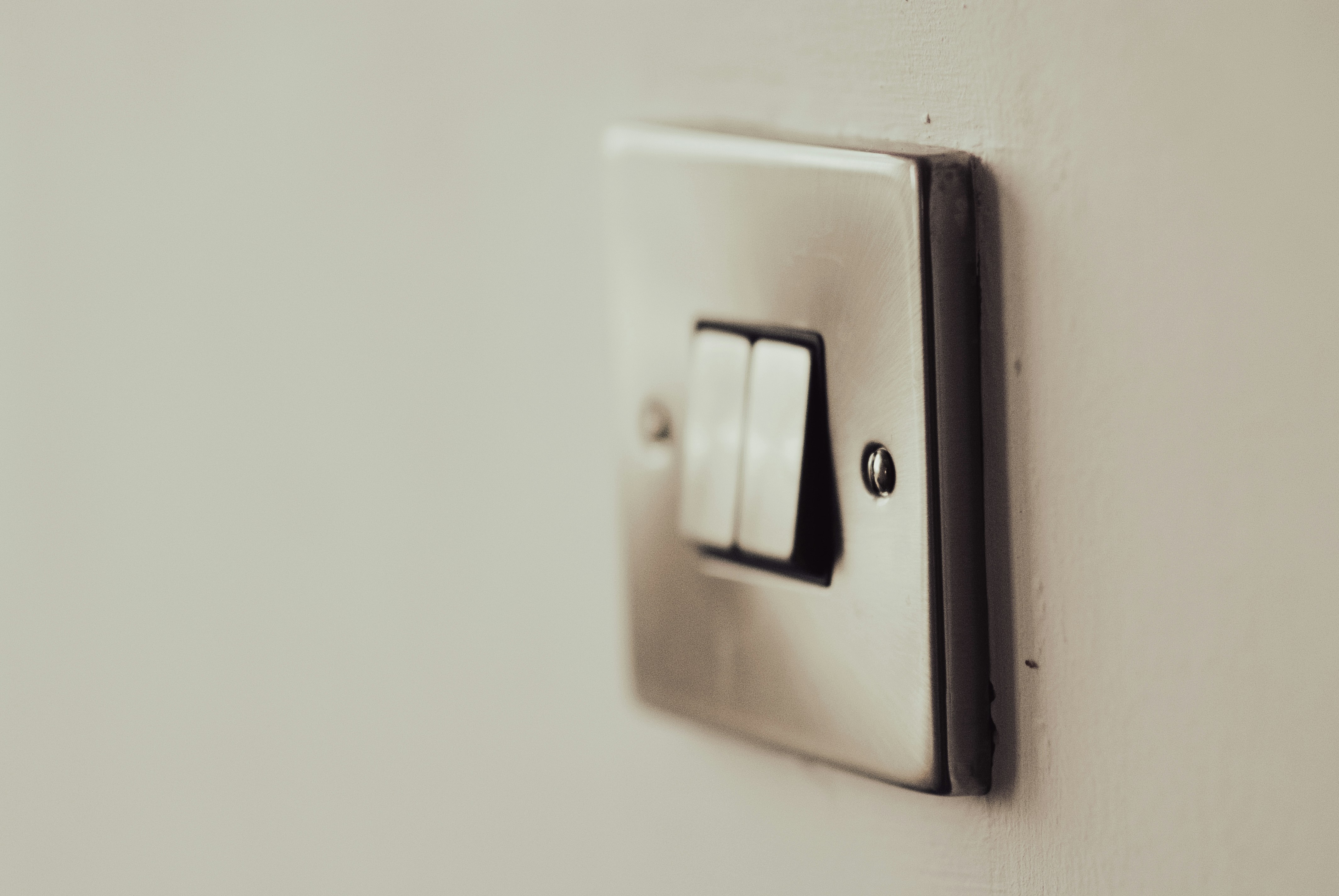 Light switch on a white wall