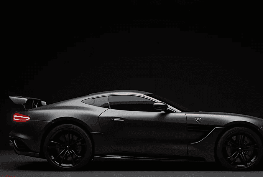 A sleek black sports car is shown in profile against a dark background, highlighting its aerodynamic design.