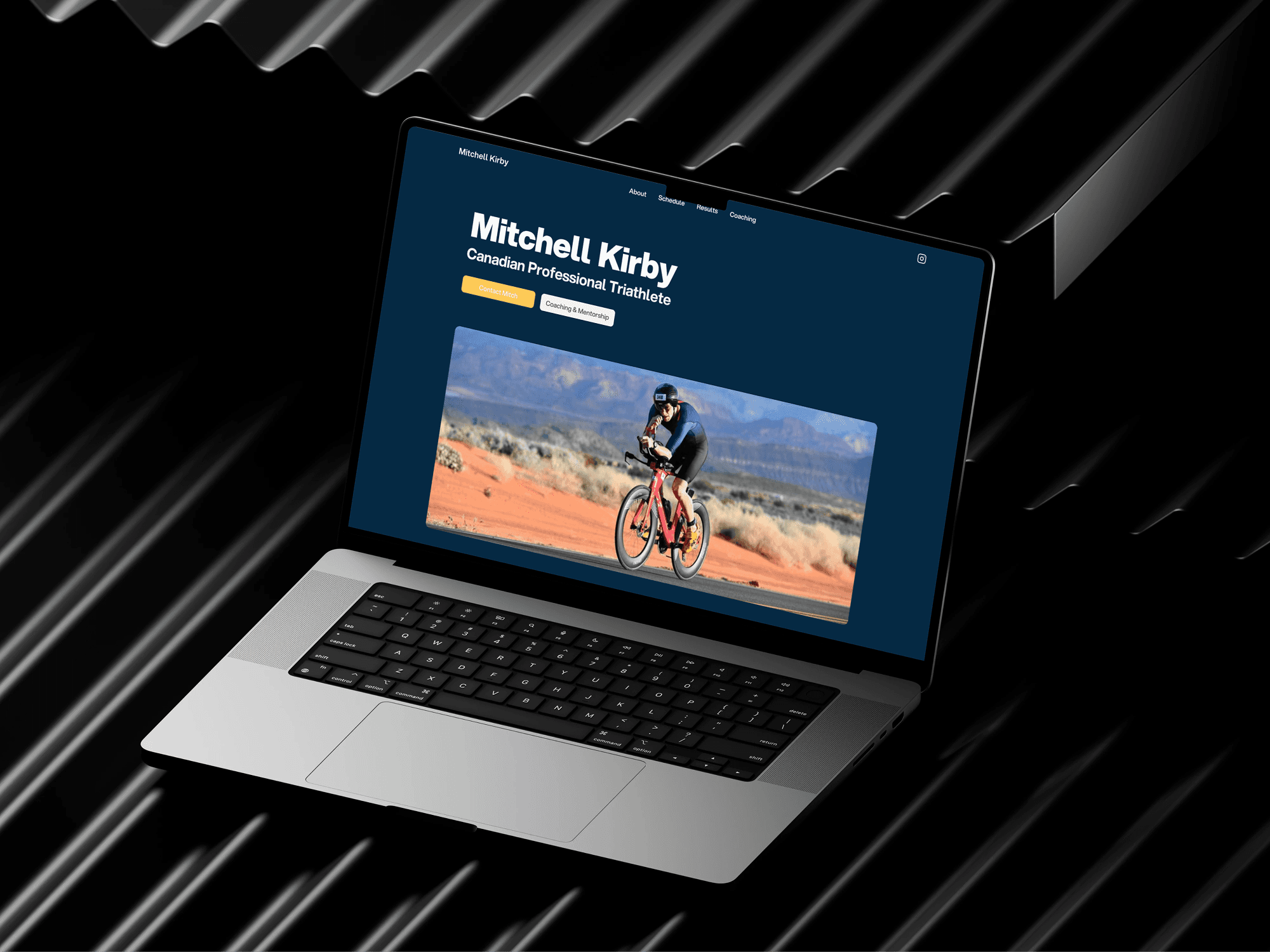 Device mockup of Mitchell Kirby's website hero section