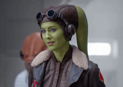 Hera Syndulla in a brown flight bomber jacket with a brown leather helmet with goggles