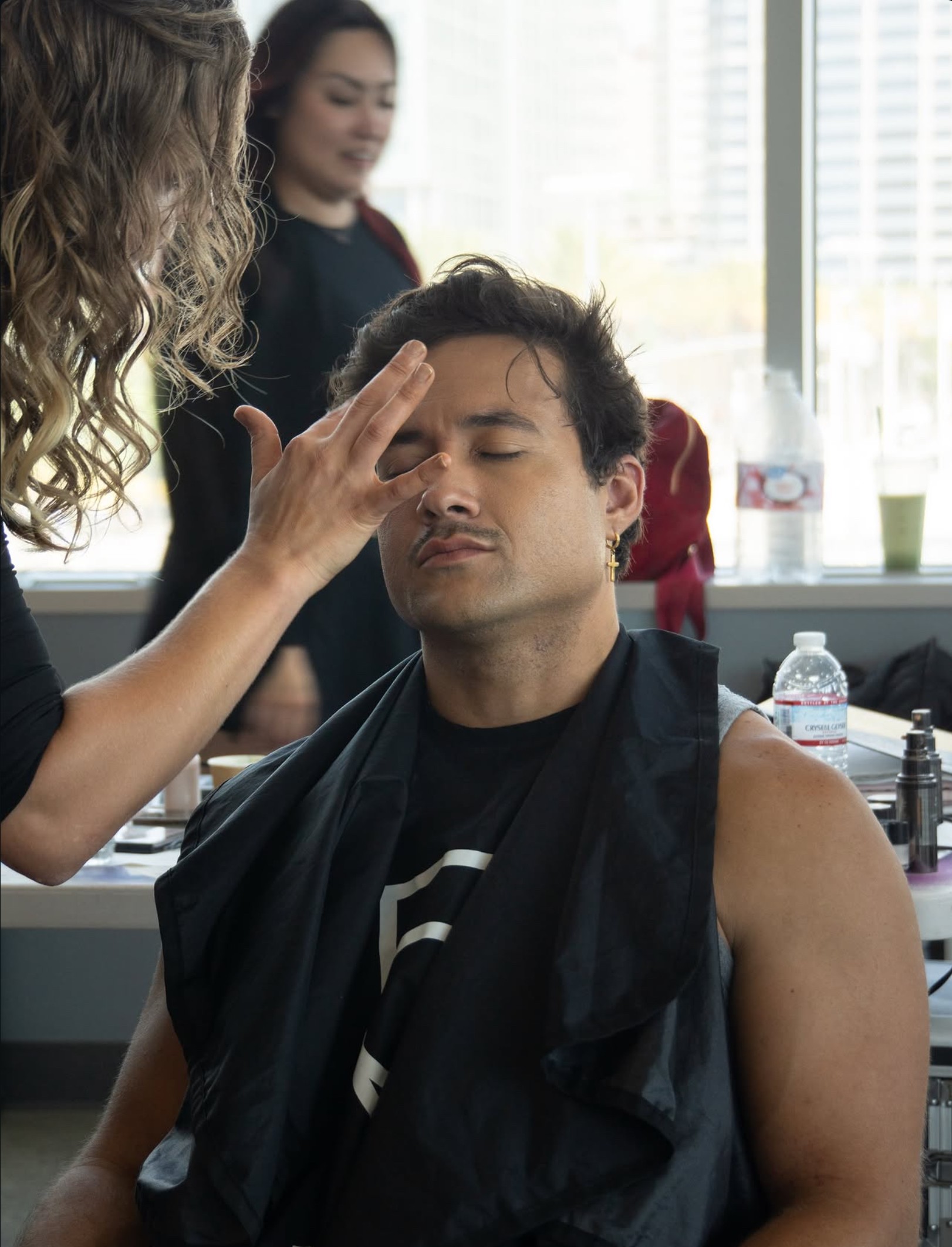 Makeup artist preparing a performer