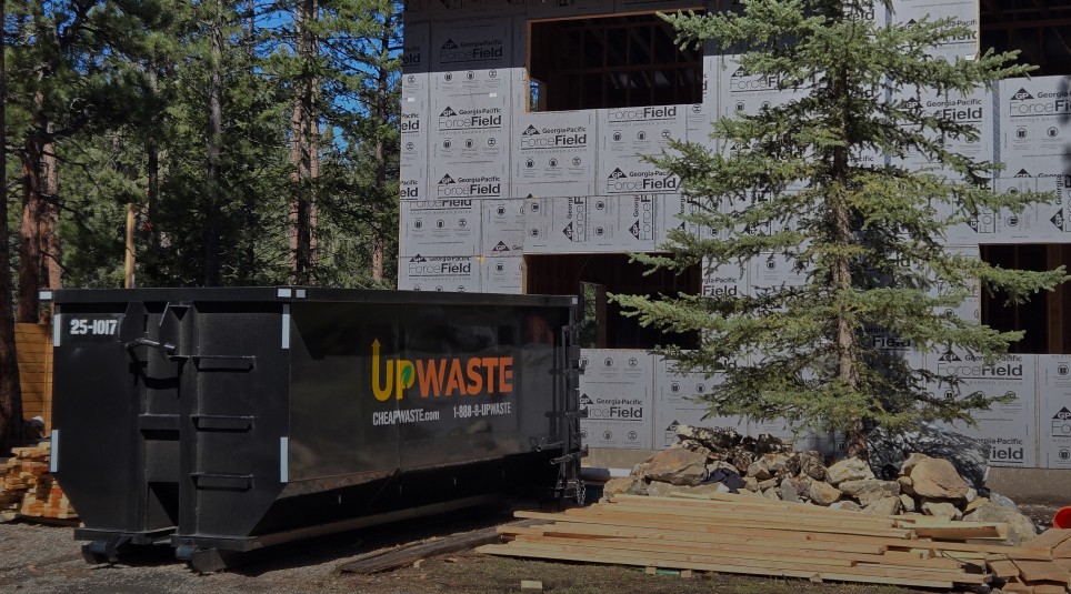 large dumpster placed in front of a residential house
