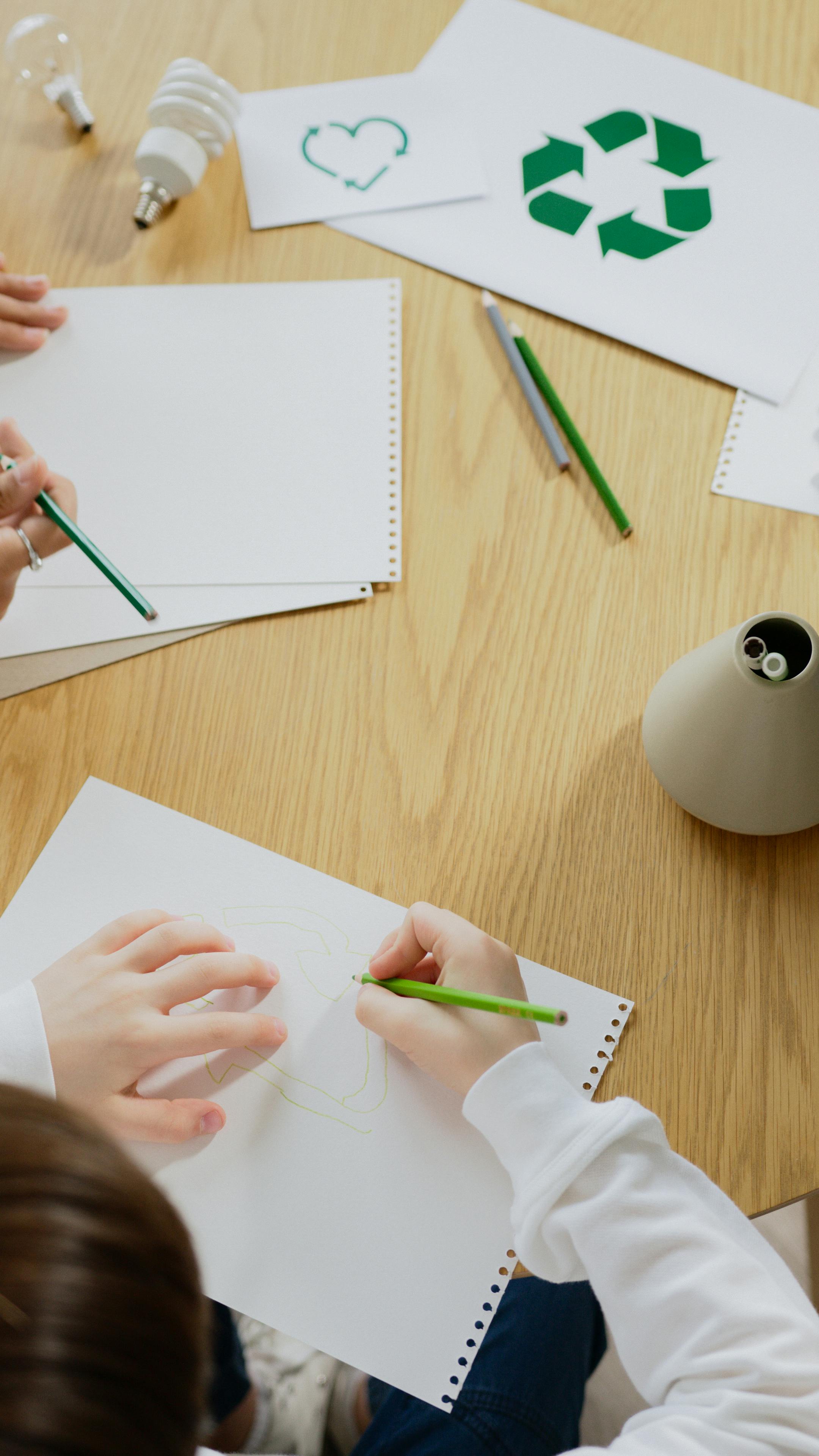 kids-drawing-eco-friendly-symbols,-promoting-recycling-and-sustainability. - artem-podrez (pexels)