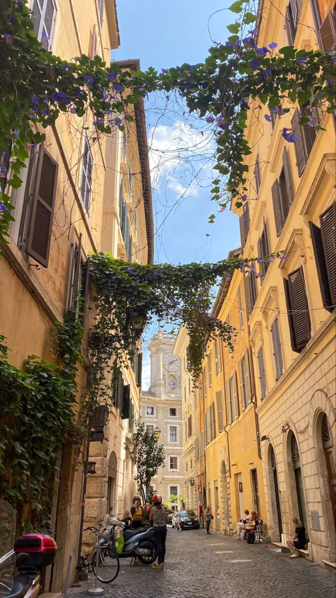 A peaceful, sun-drenched street in Rome during the shoulder season, showcasing the perfect time for a calm city visit.