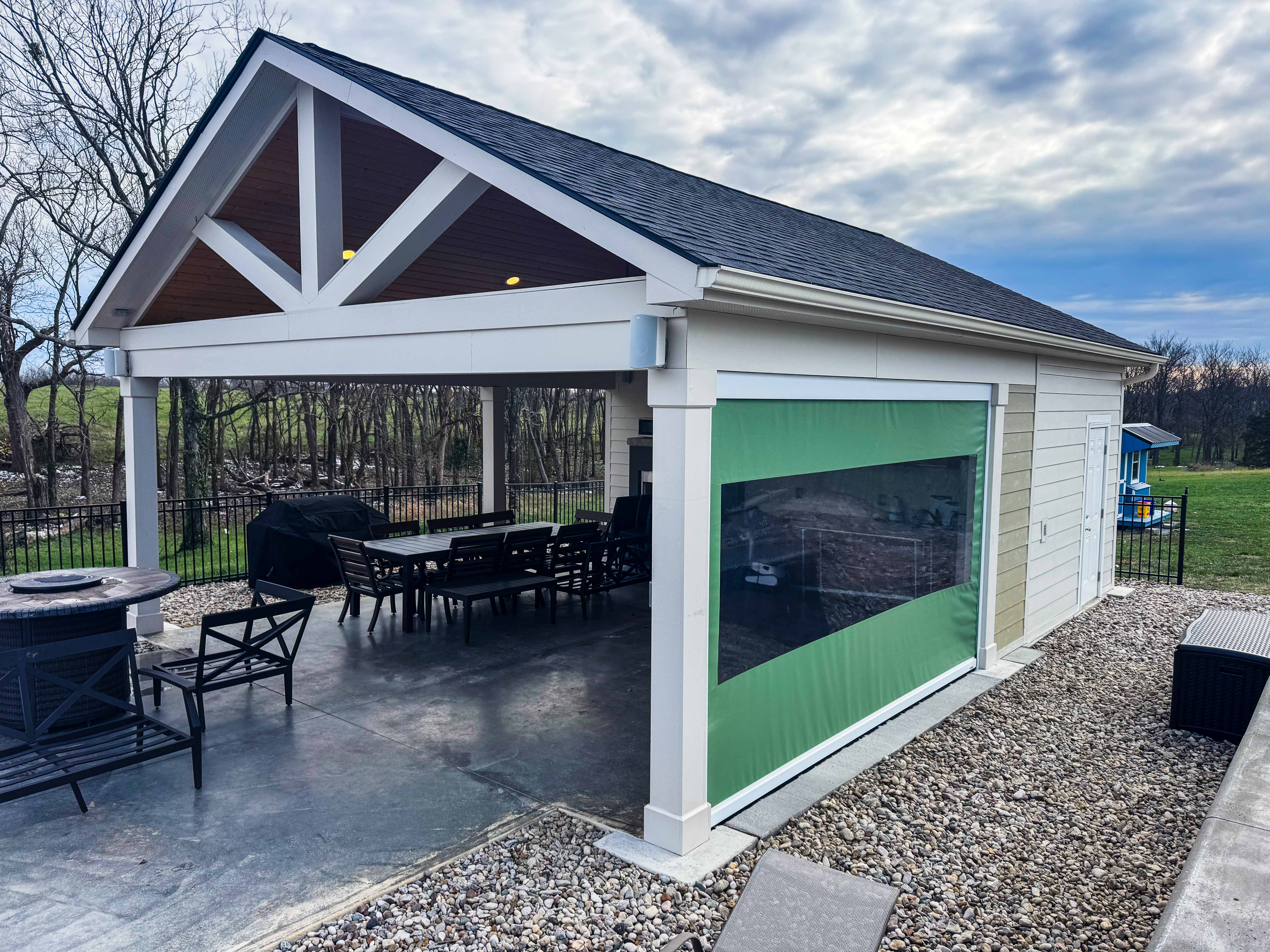 Modern pavilion with retractable screen in Lexington backyard