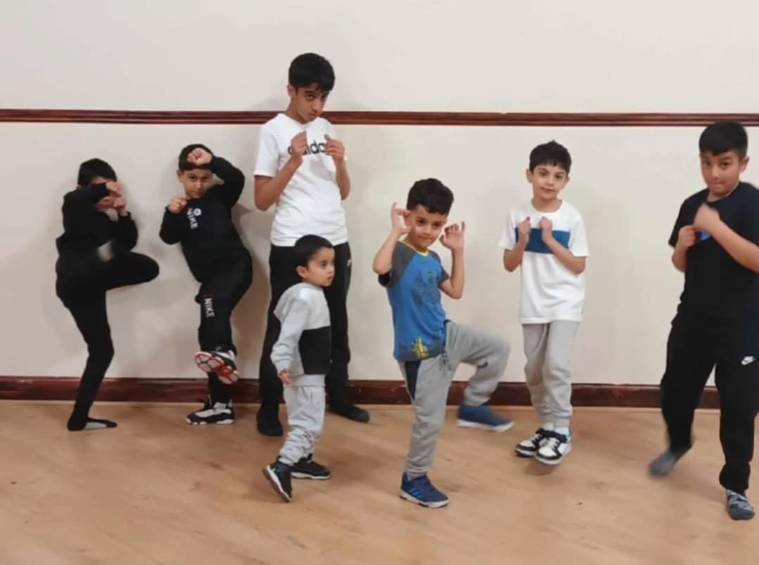 Group of kids holding poses