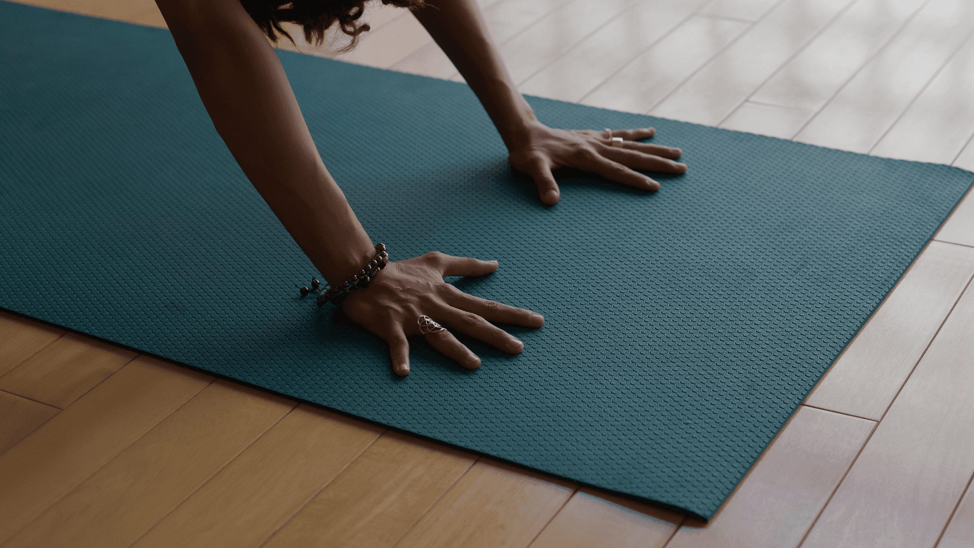 Angeled shot of a woman doing yoga in a beautiful space