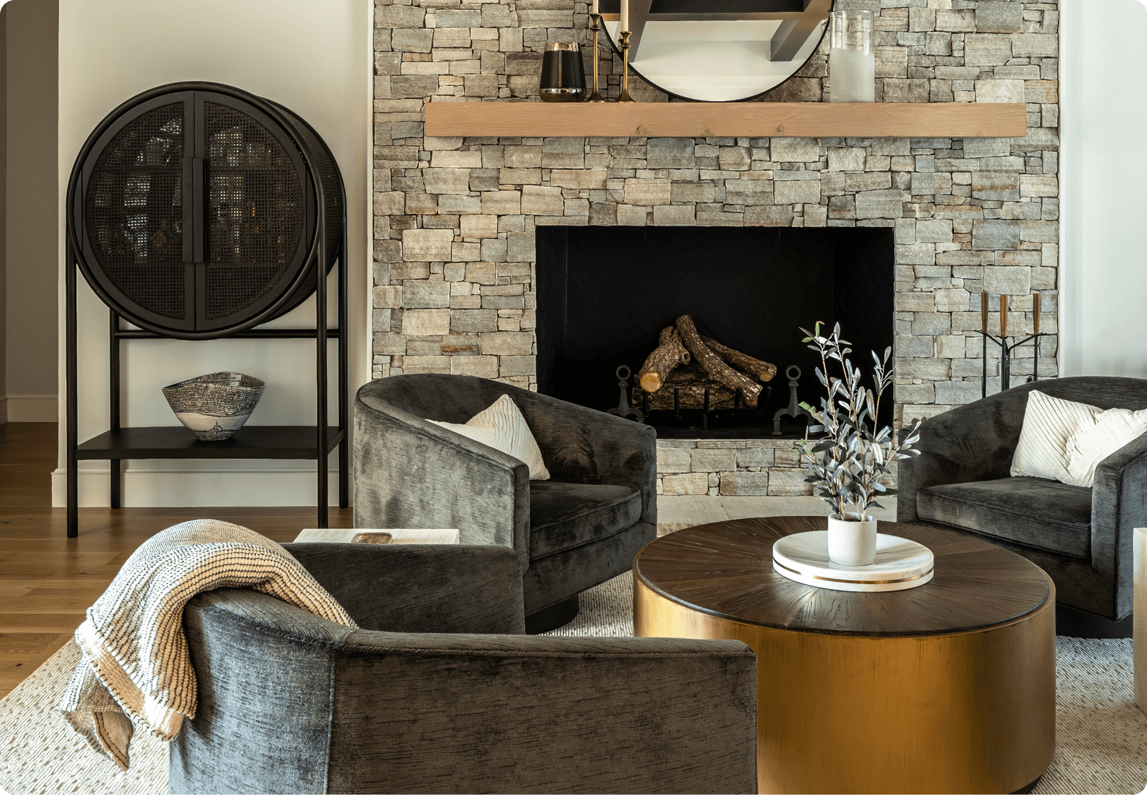Luxurious primary bathroom with copper freestanding tub, crystal chandelier, and hexagonal tile backsplash