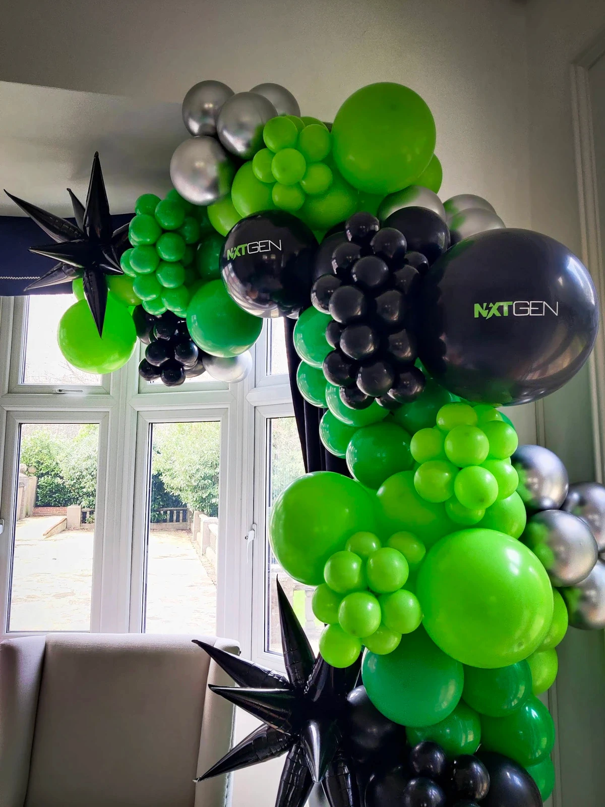 Branded balloon arrangement in corporate colors