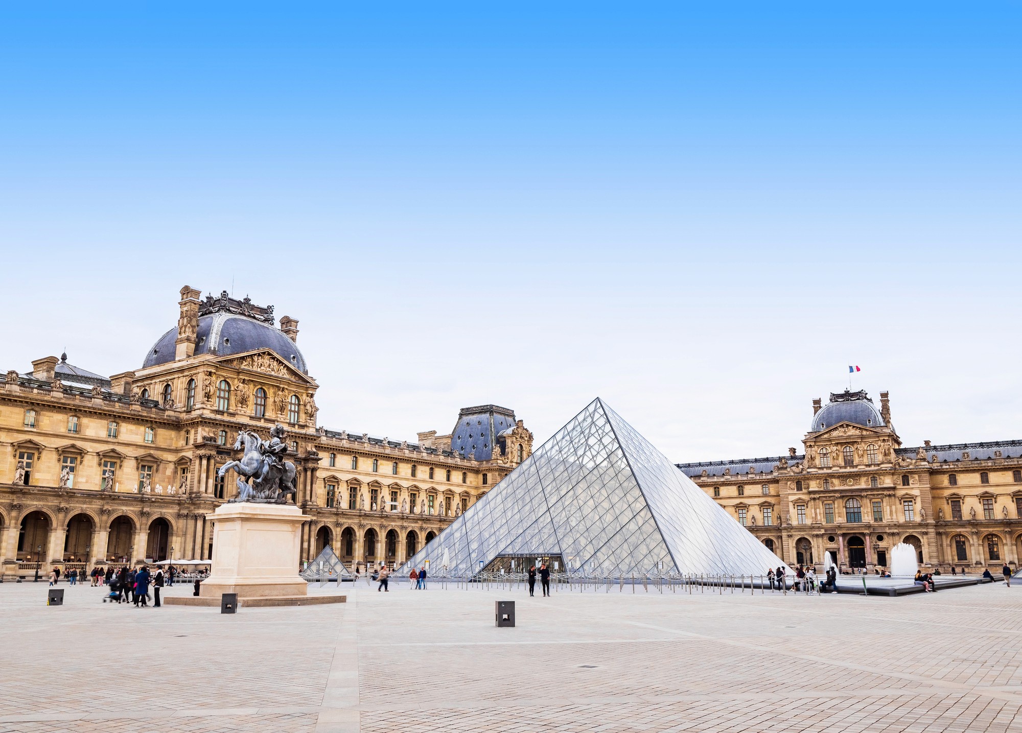 A wooden walkway leading to a body of water
