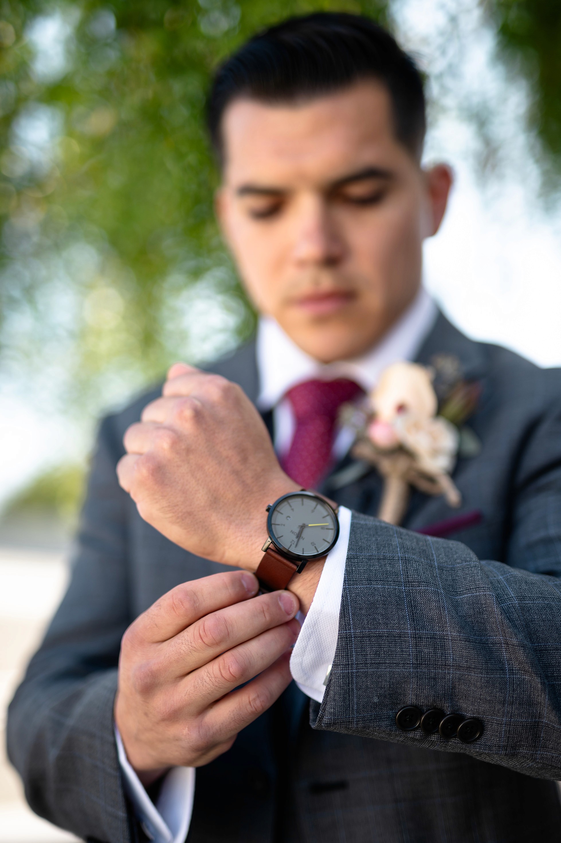 Groom getting ready portrait before Sacred Heart Church ceremony
