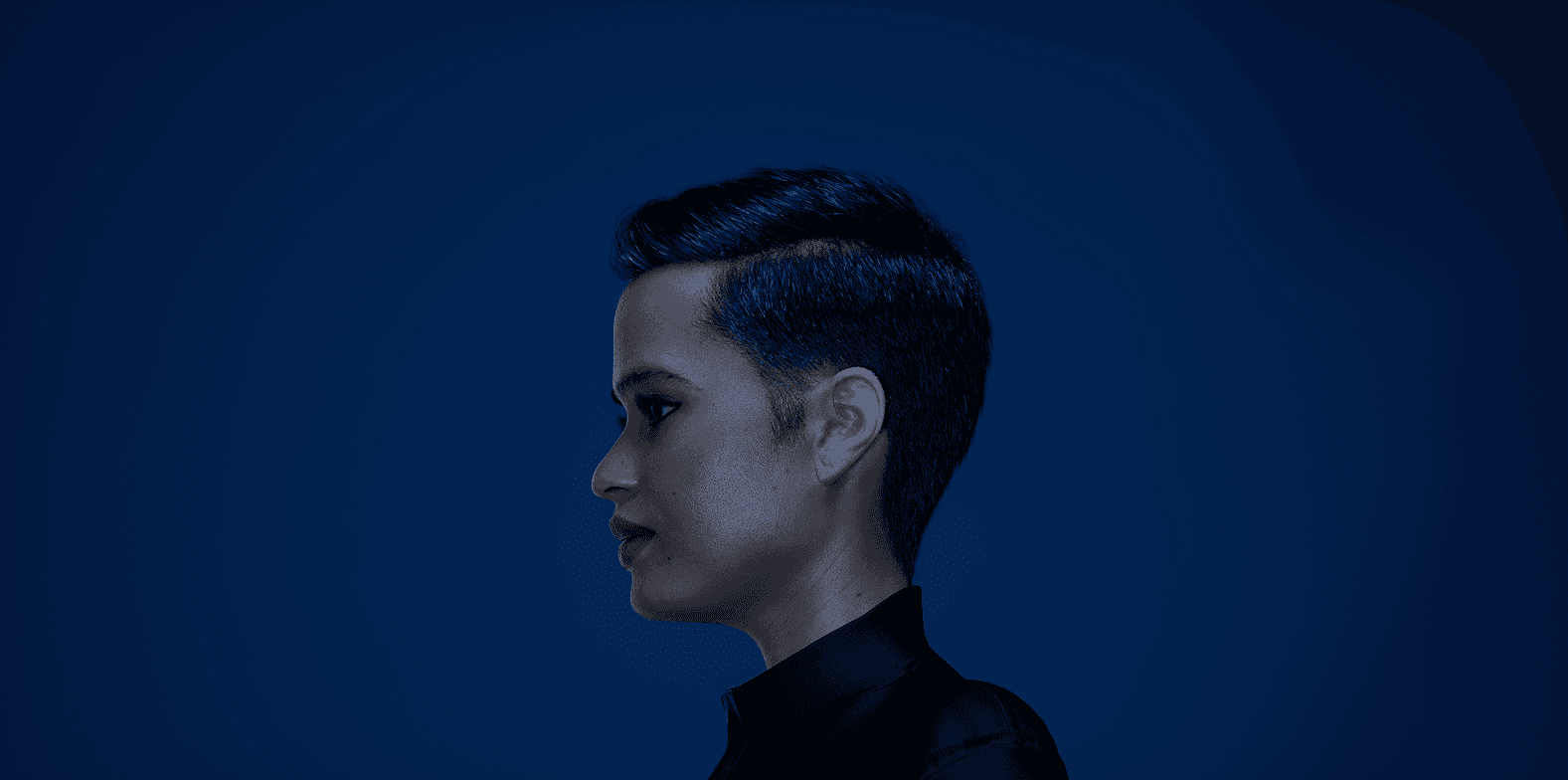 Close-up of white fur with black heart-shaped spots—soft, high-contrast texture for fashion/home décor.