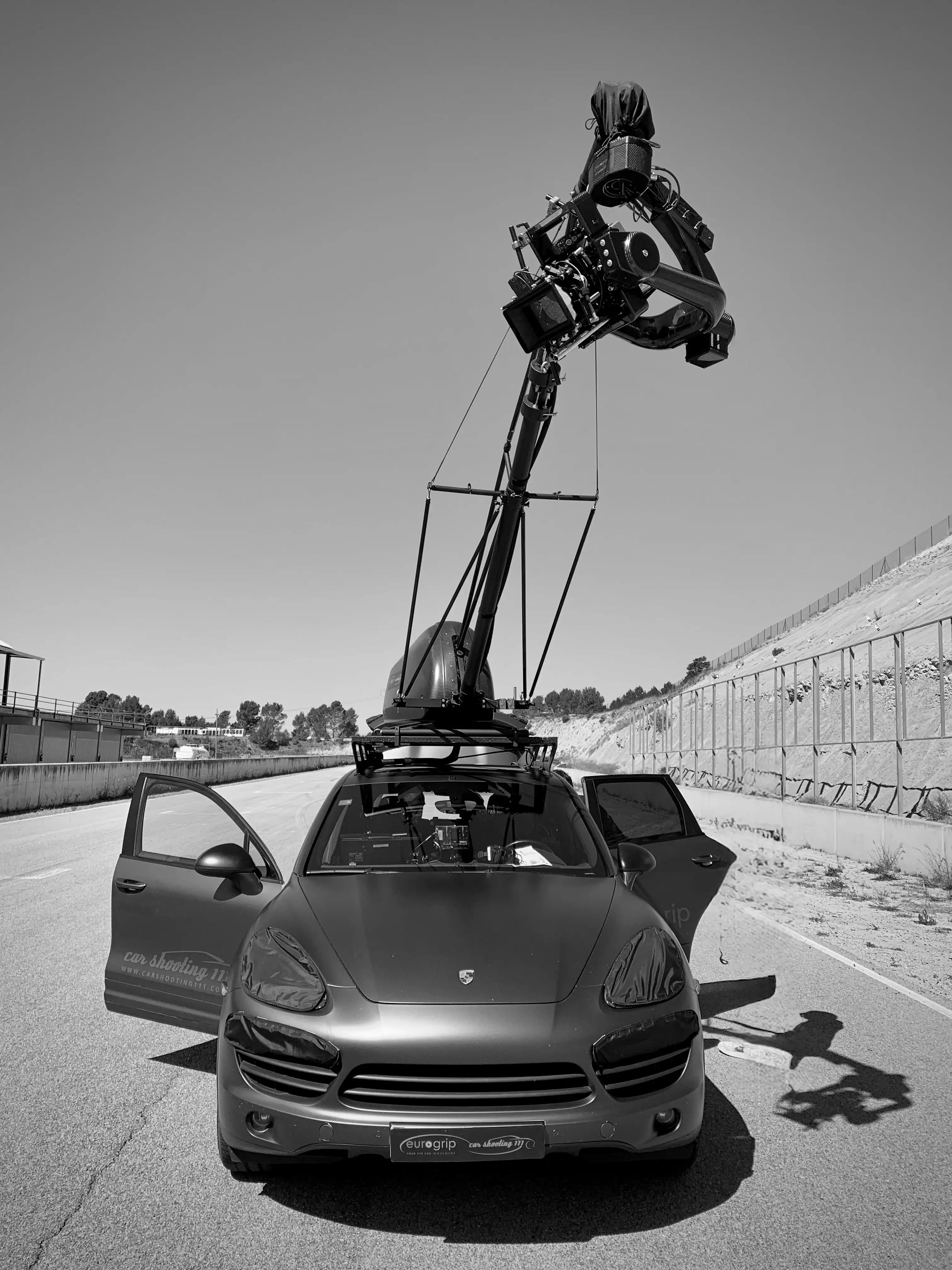Camera rig filming a car on location