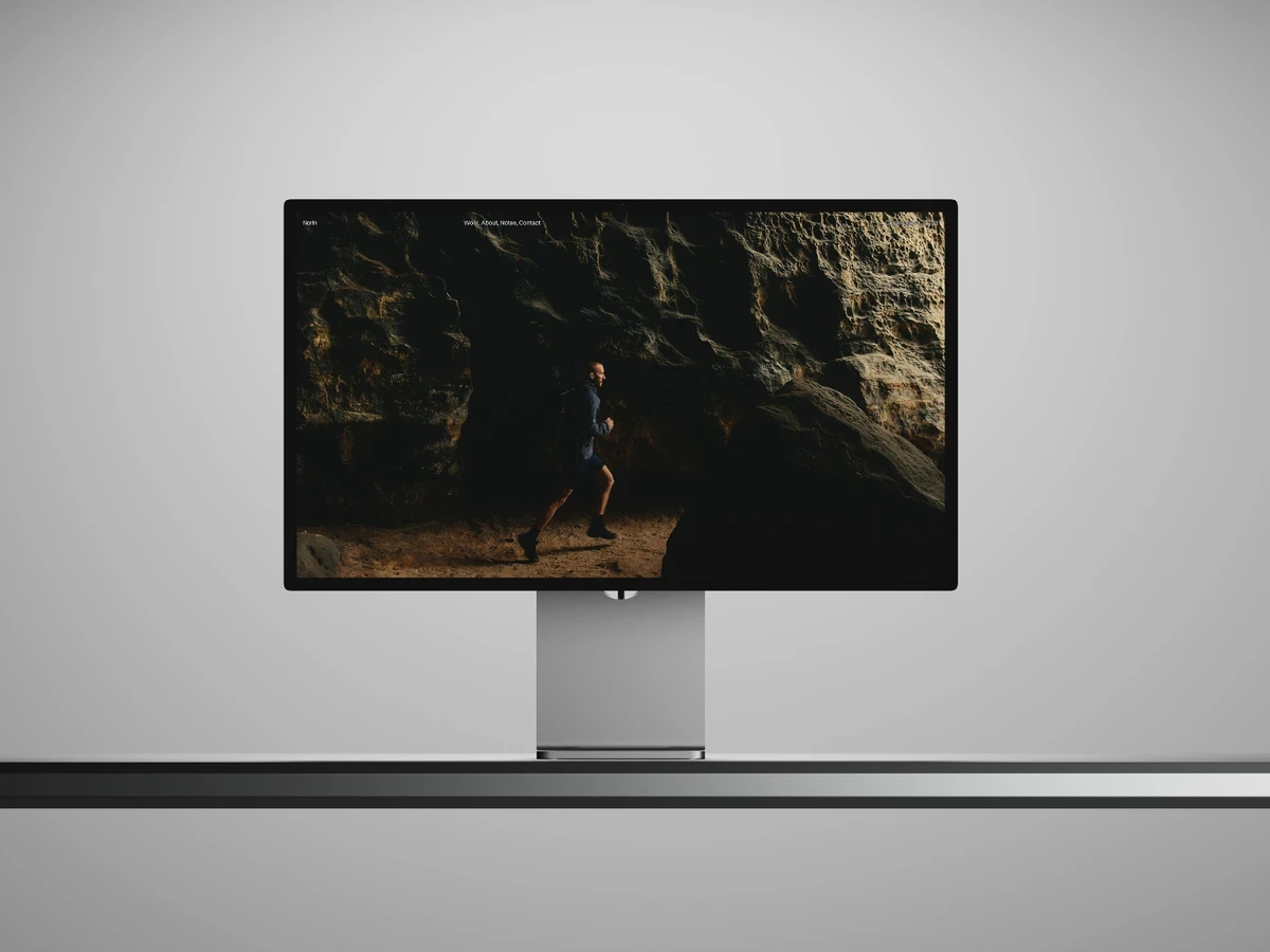 Featured preview of Norin, a photography portfolio Framer template featuring a minimalist dark homepage with immersive full-screen imagery.
