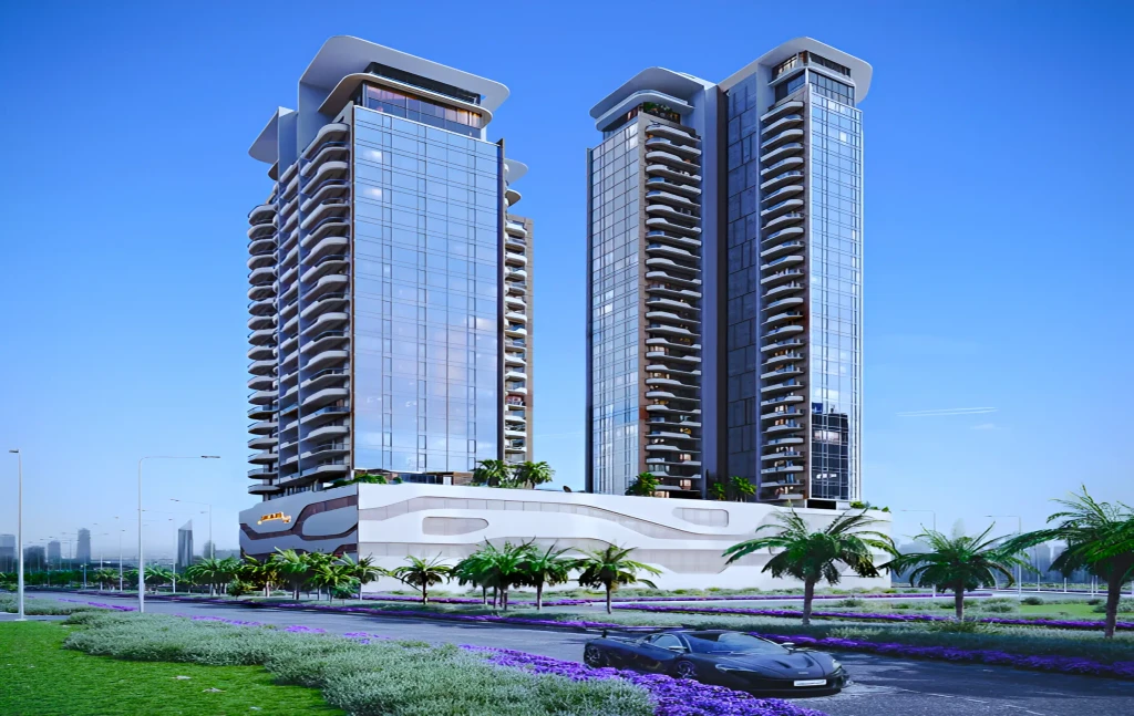 Two tall buildings stand beside each other as a car drives past Orchard Place (260).