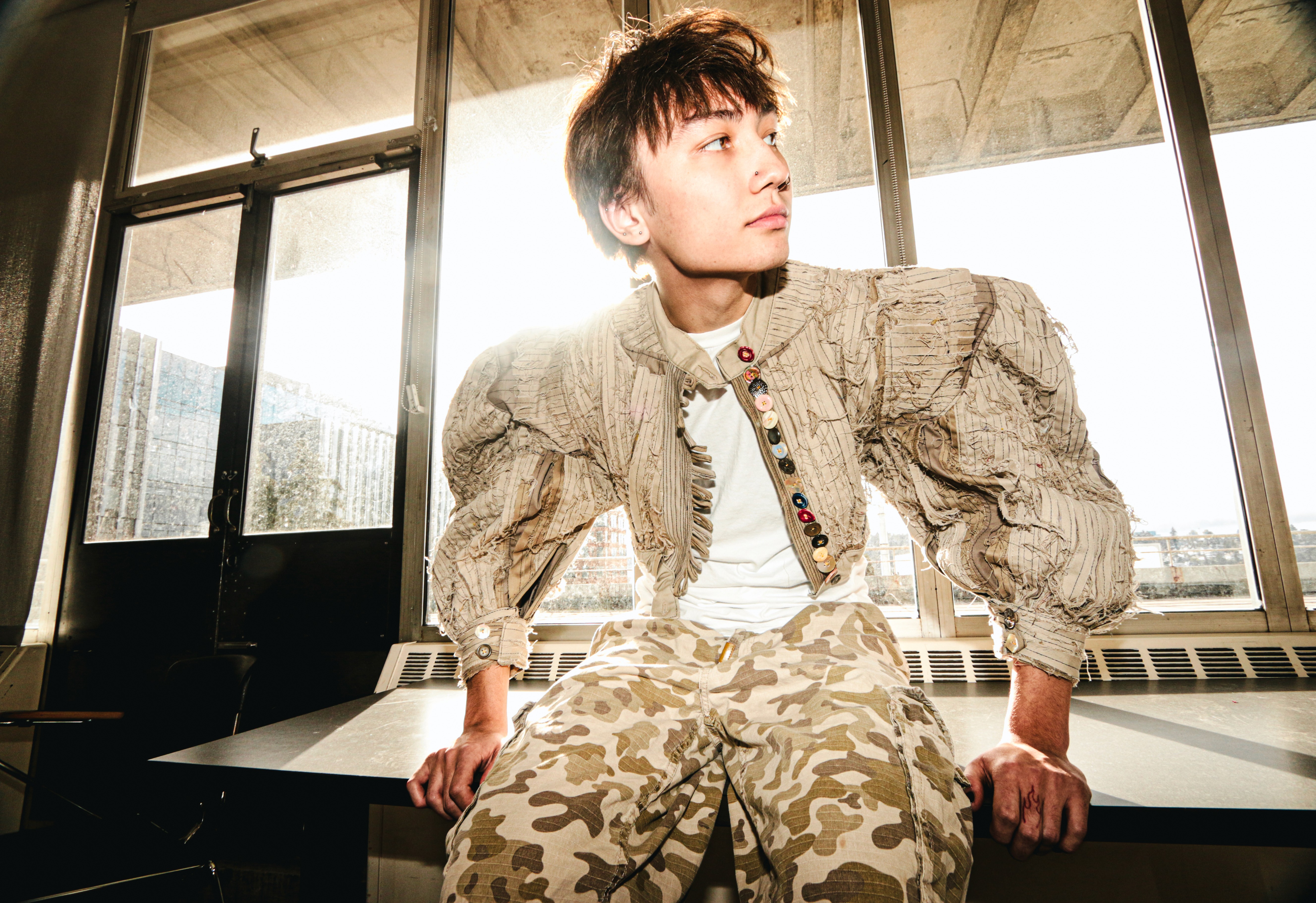 Minimalist book cover on white stairs with clean editorial design