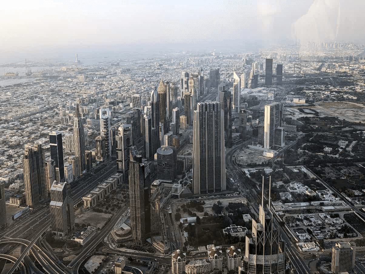an aerial view of tall skyscrapers and the skyline in Dubai