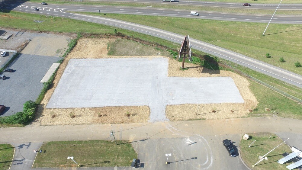 Drone overhead shot of graded lot with smoothed out gravel in a rectangular pattern